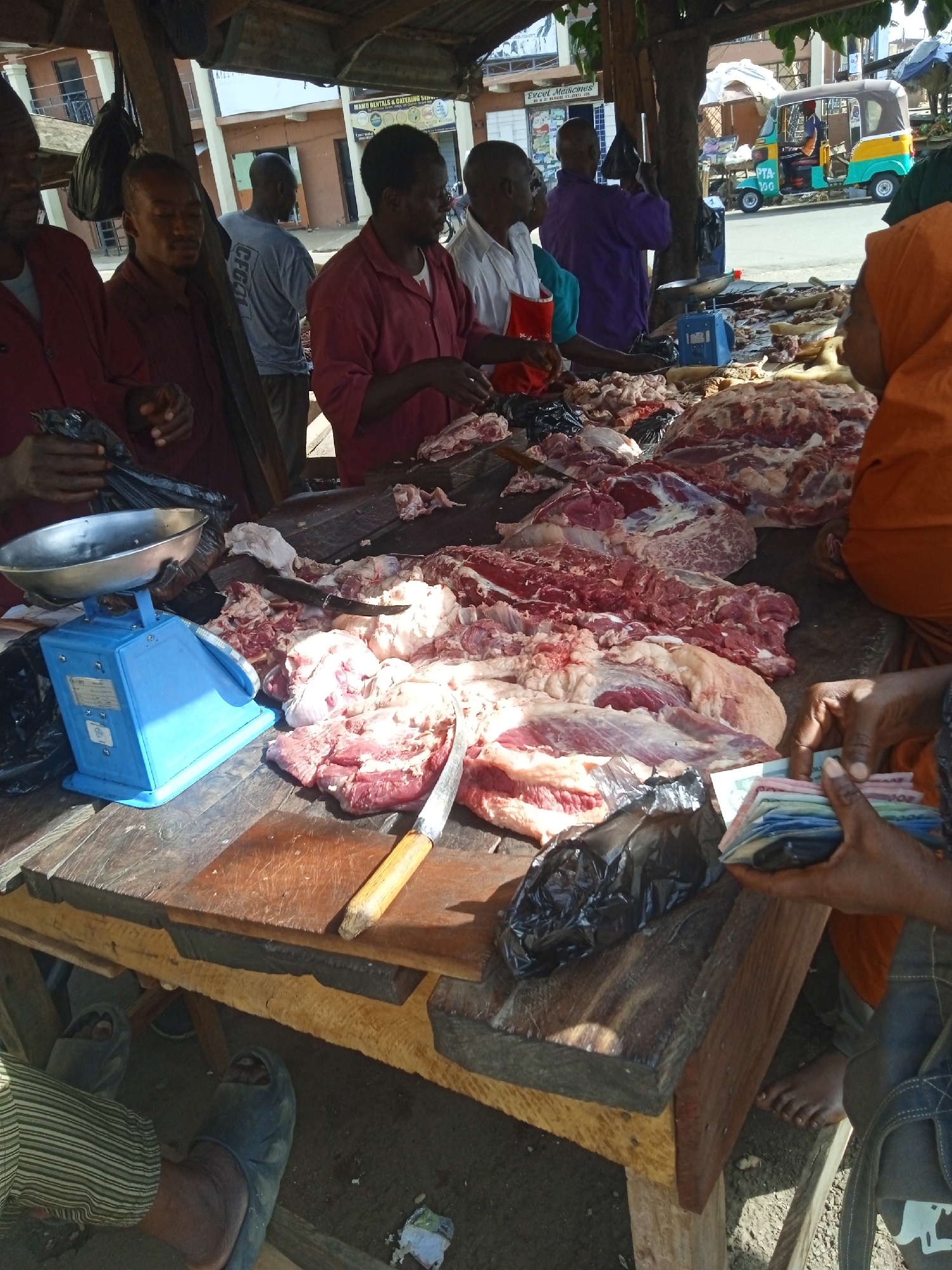 Morning meat market operations documented in Jos, Nigeria