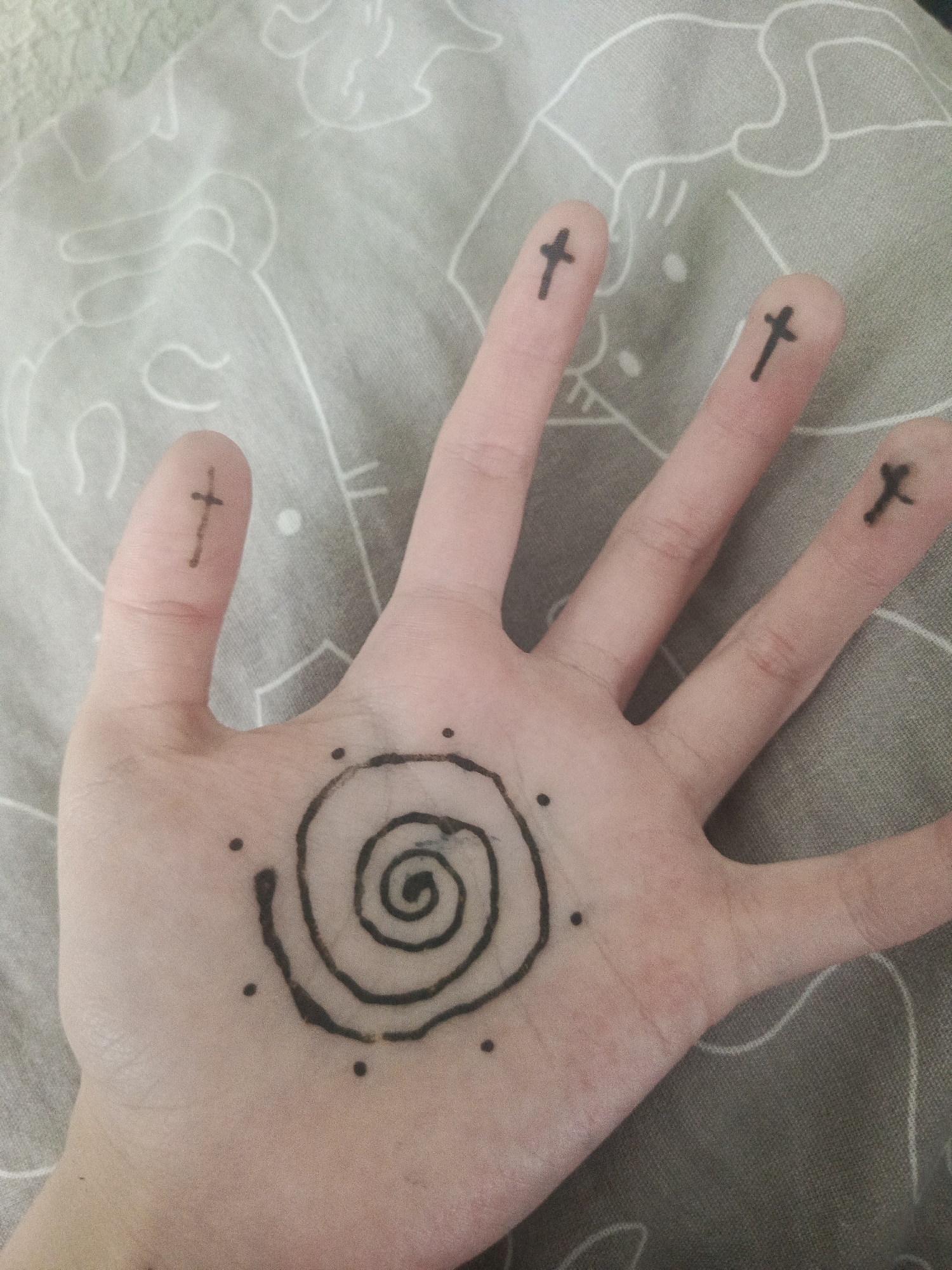 Person documents henna tattoo session and spring dandelion views