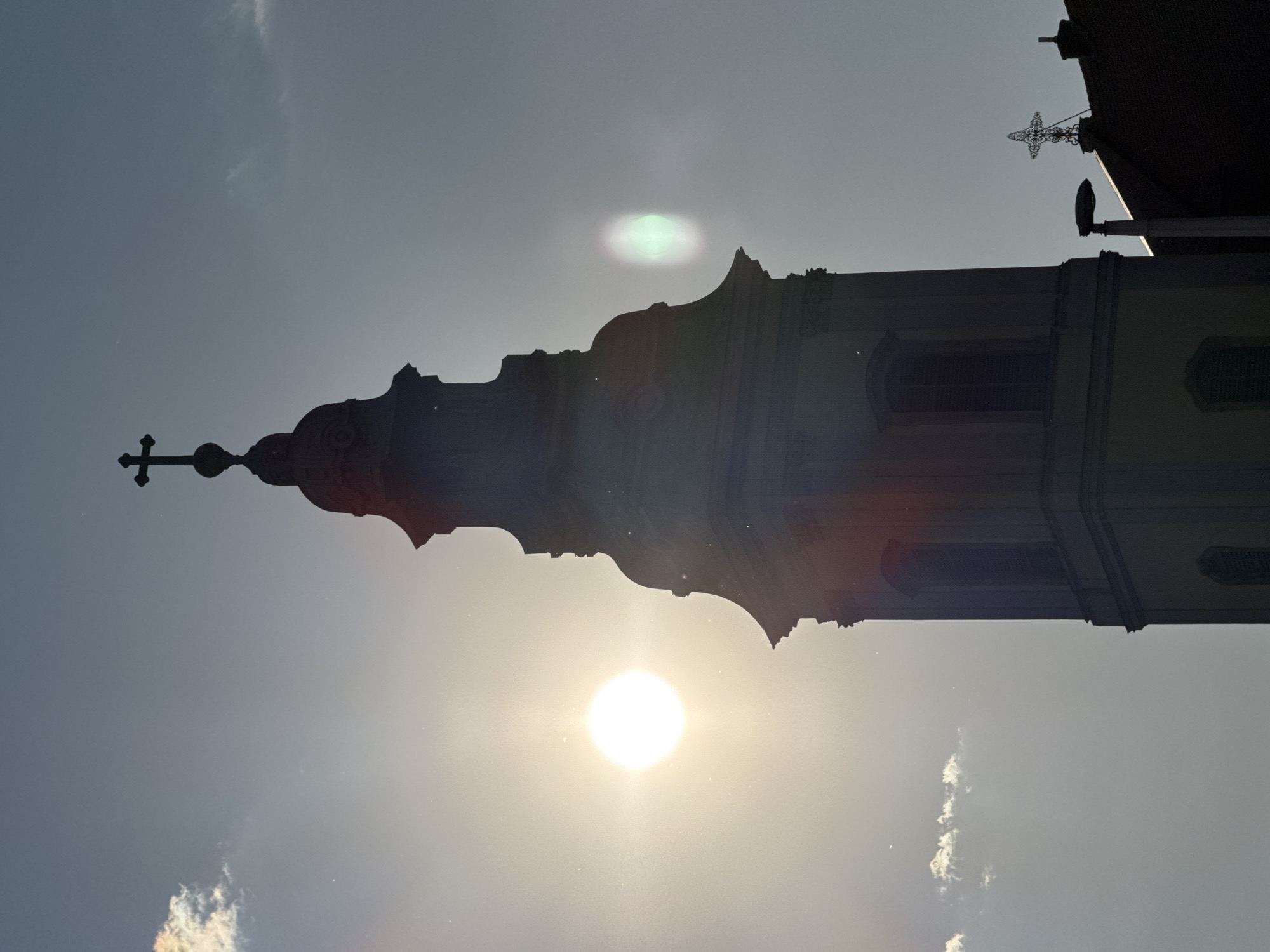 Budapest church towers documented under bright afternoon sun