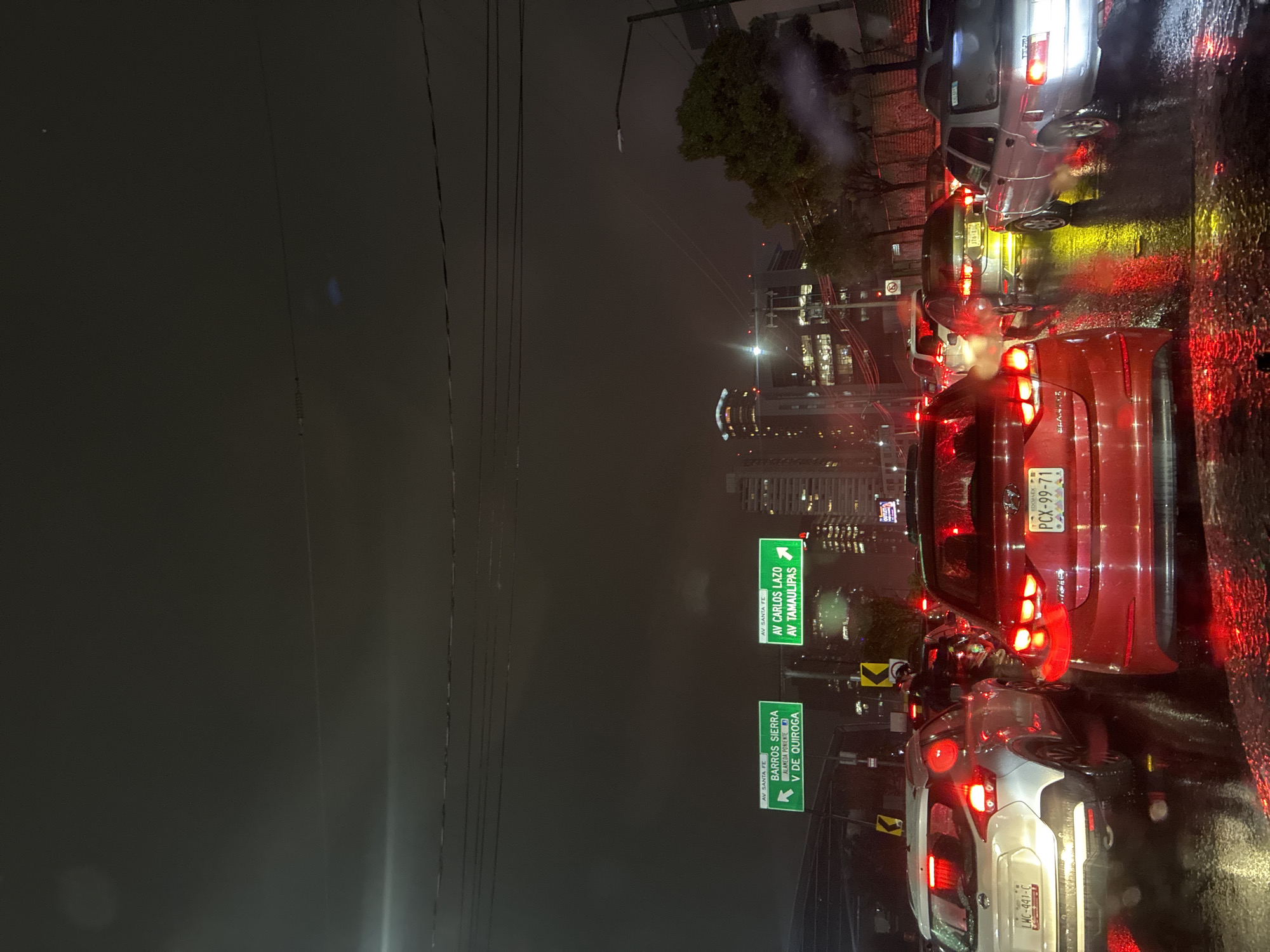 Rainy night traffic observed in Mexico City streets