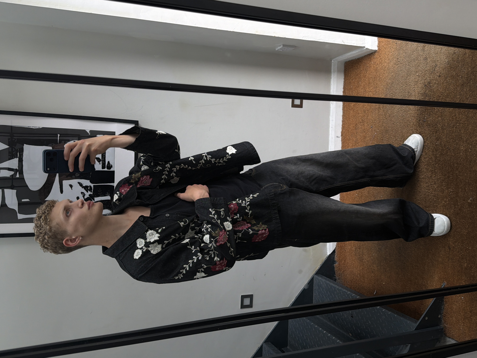 Mirror selfie captured in London showing embroidered denim jacket
