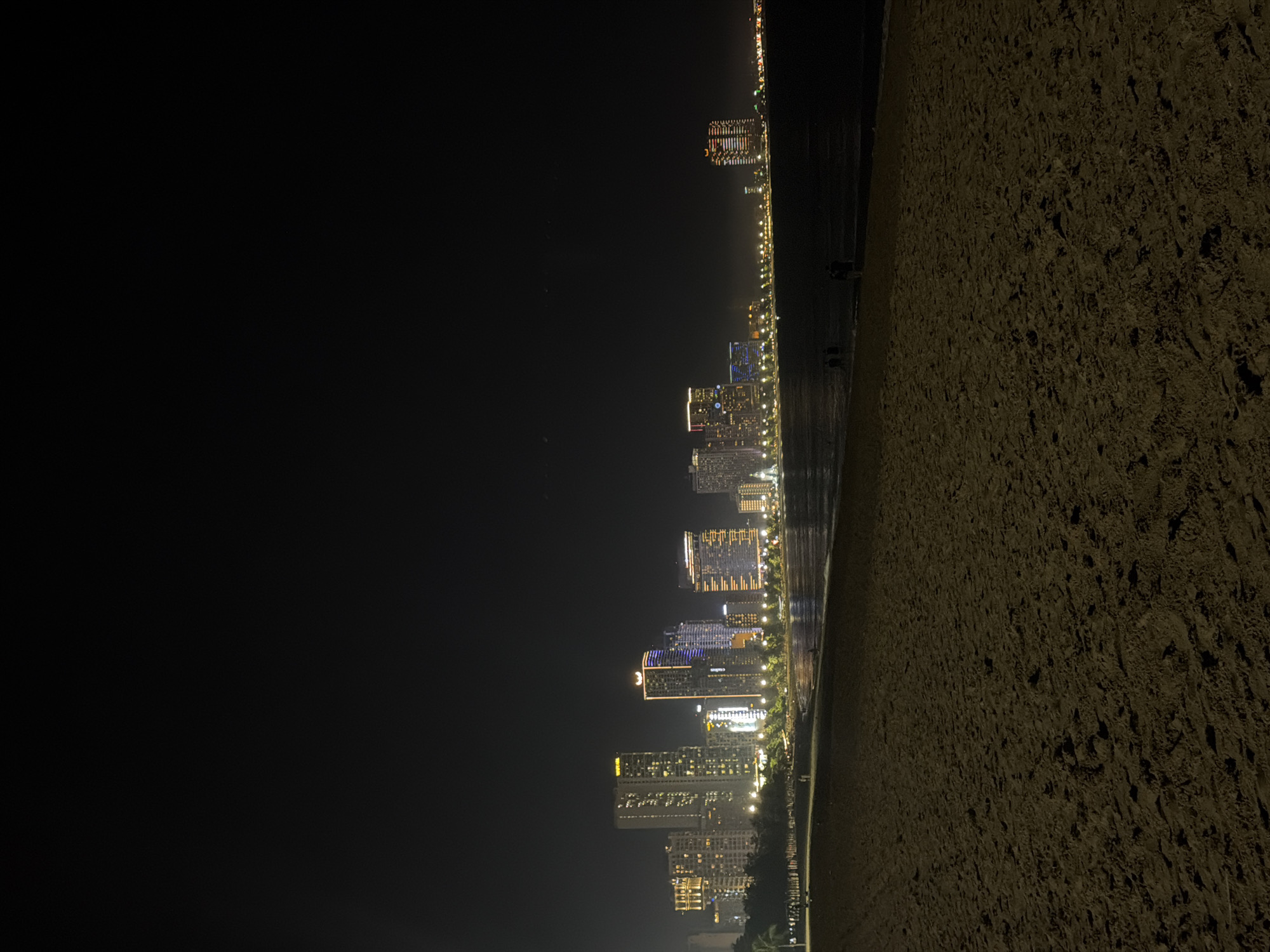 Evening beach life captured under full moon in Nha Trang