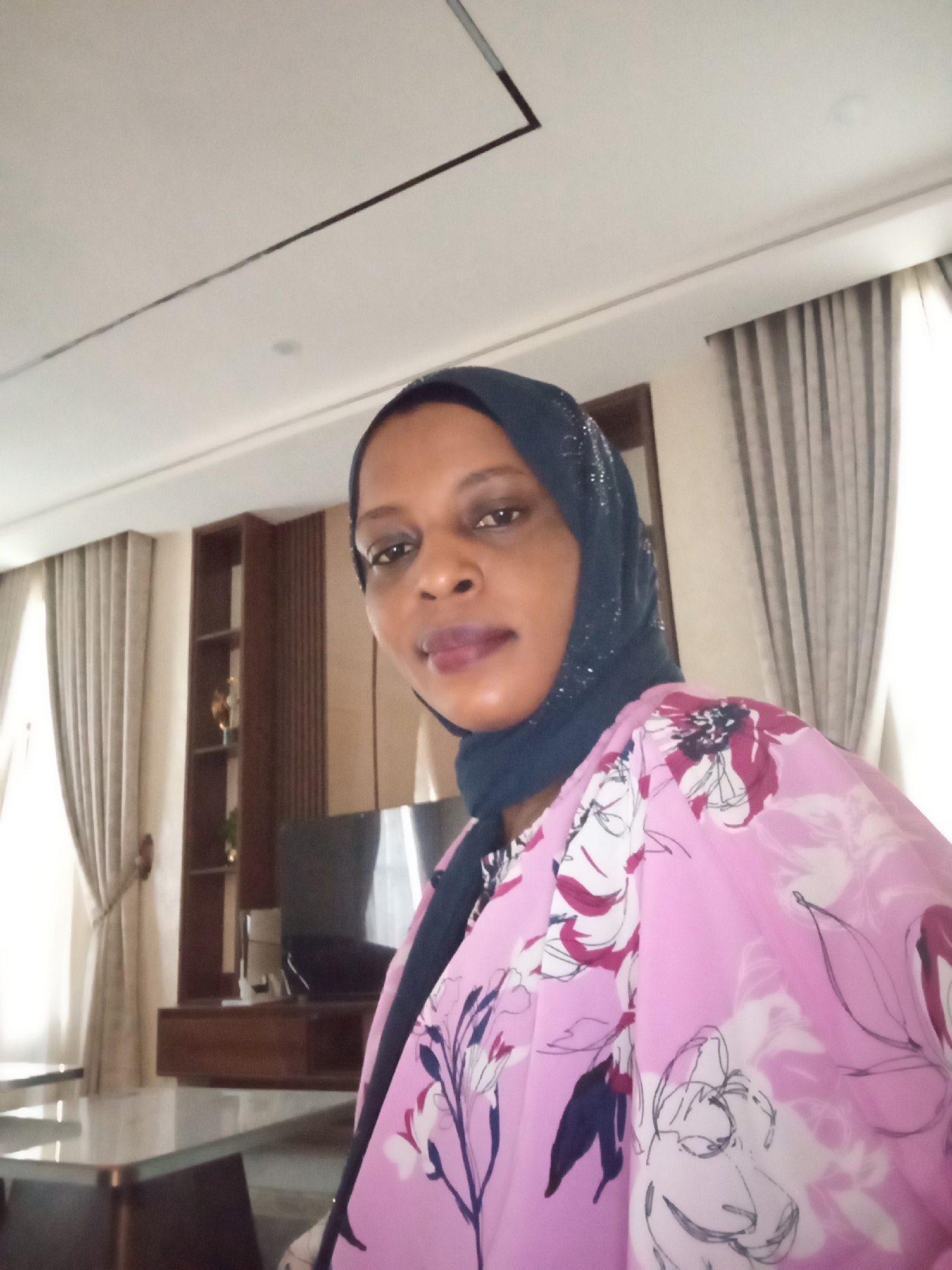 Woman photographed in home setting in Unguwar Rimi, Nigeria