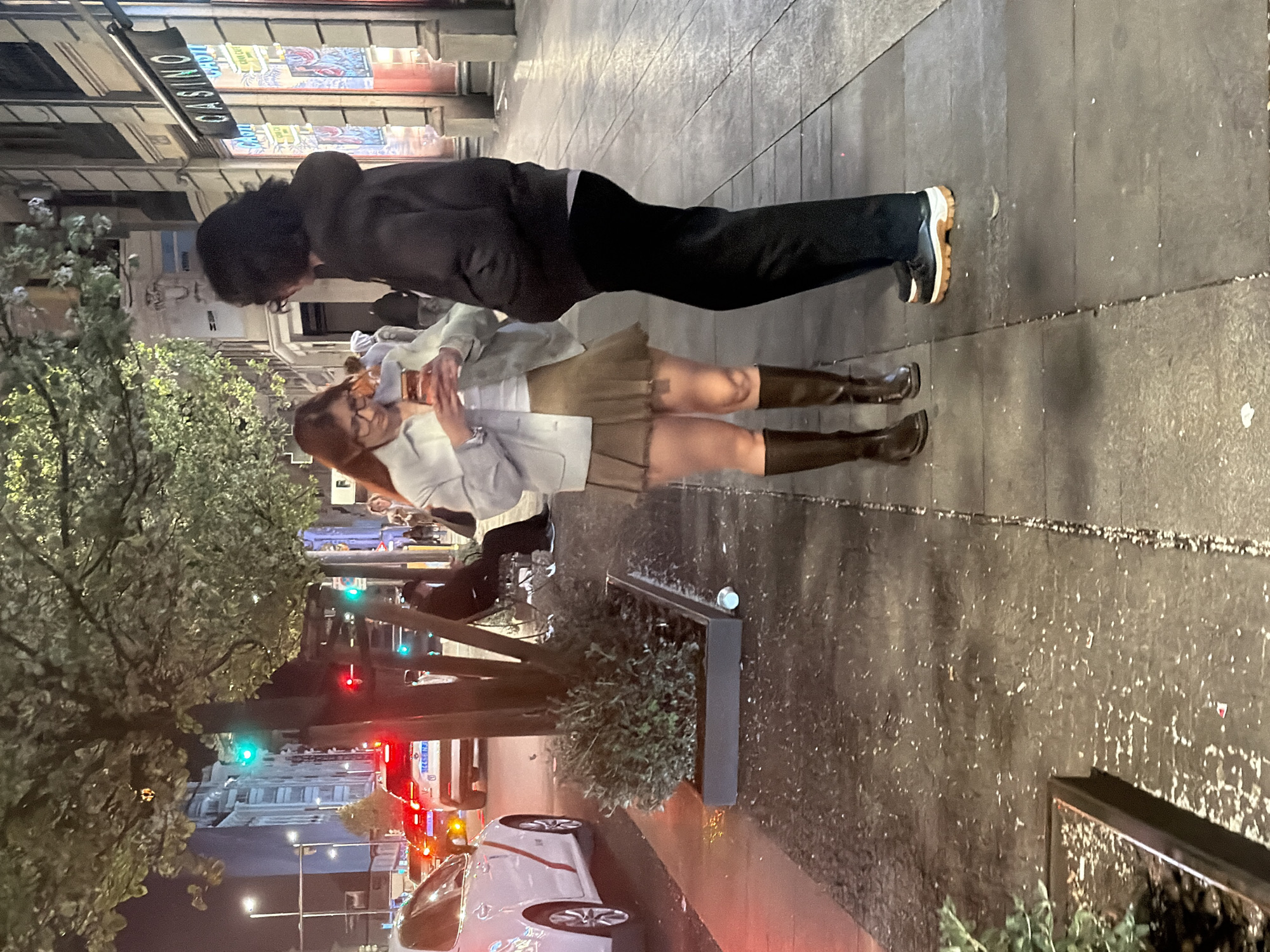 Two people stand outside Madrid casino early morning