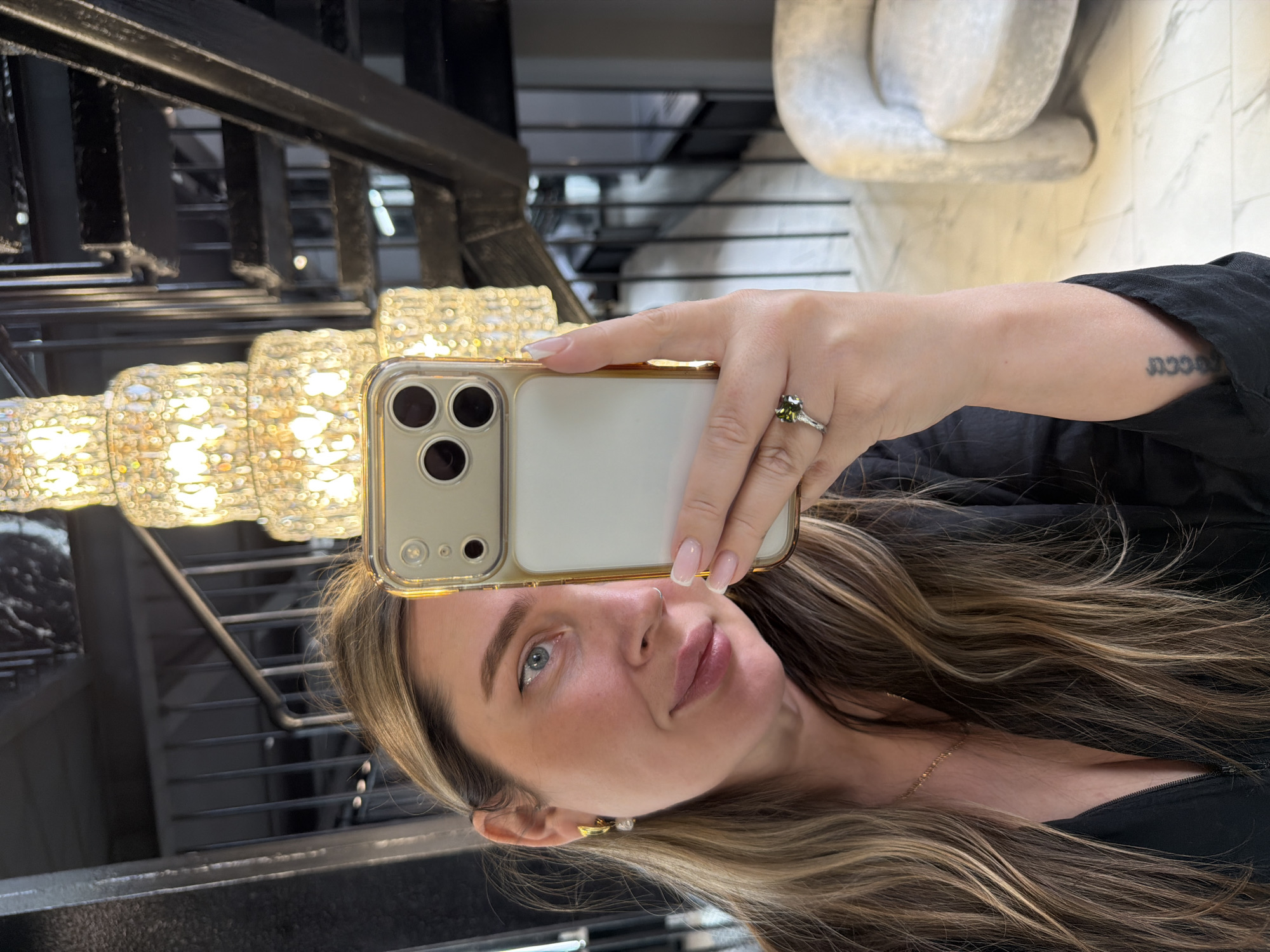 Woman takes mirror selfies in upscale Moscow interior