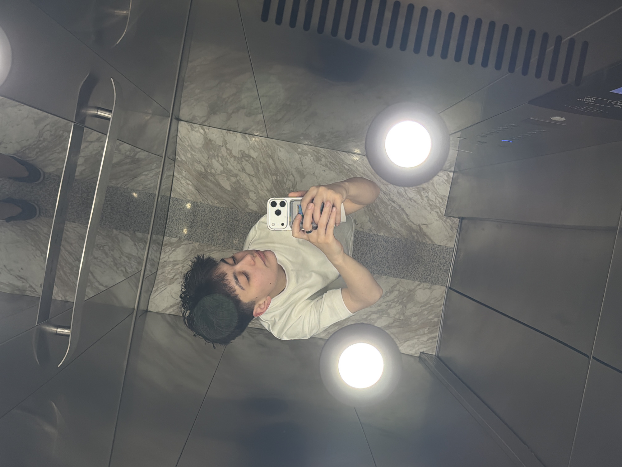 Young man takes selfie in Yerevan elevator