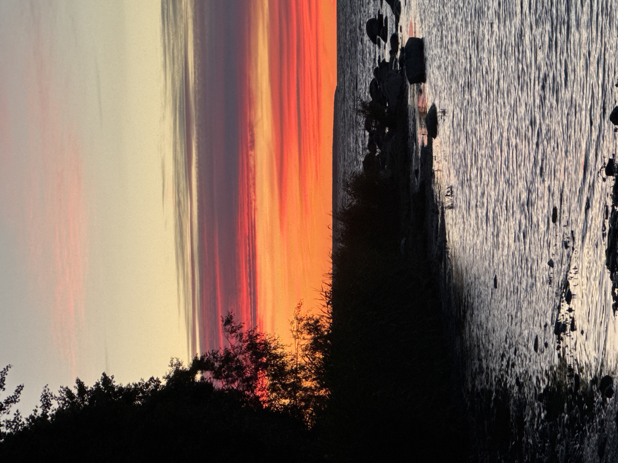 Baltic sunset along Tallinn's shoreline, midsummer evening