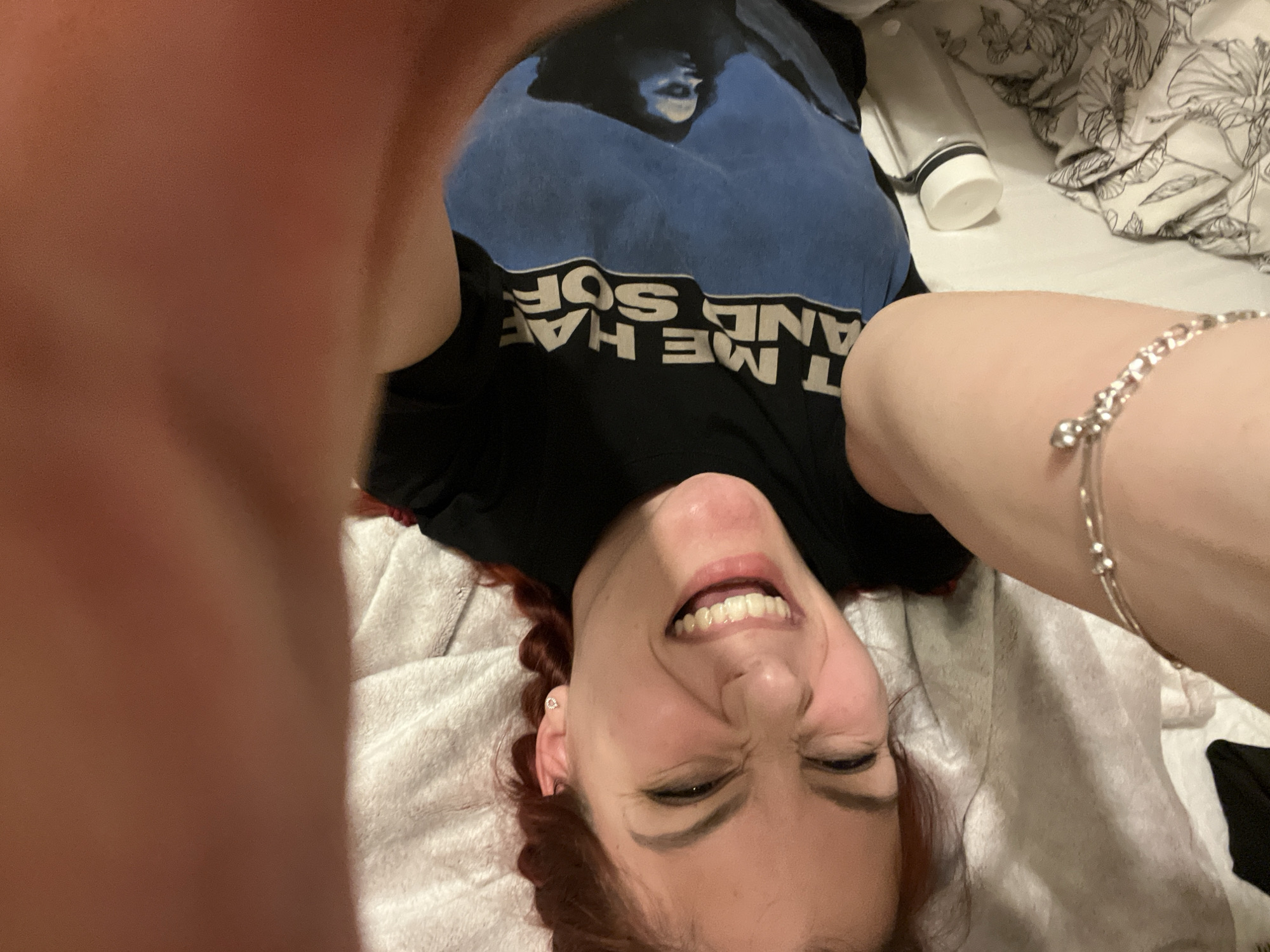 Woman takes series of selfies on bed in Sofia