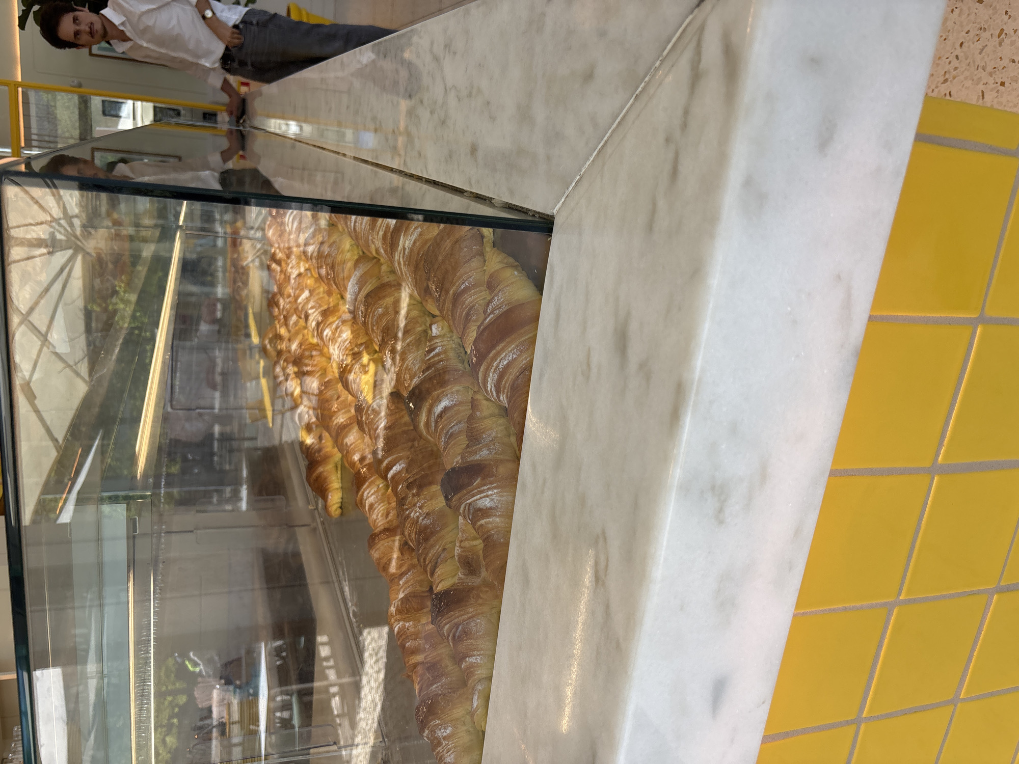 Croissants displayed in Lisbon bakery case
