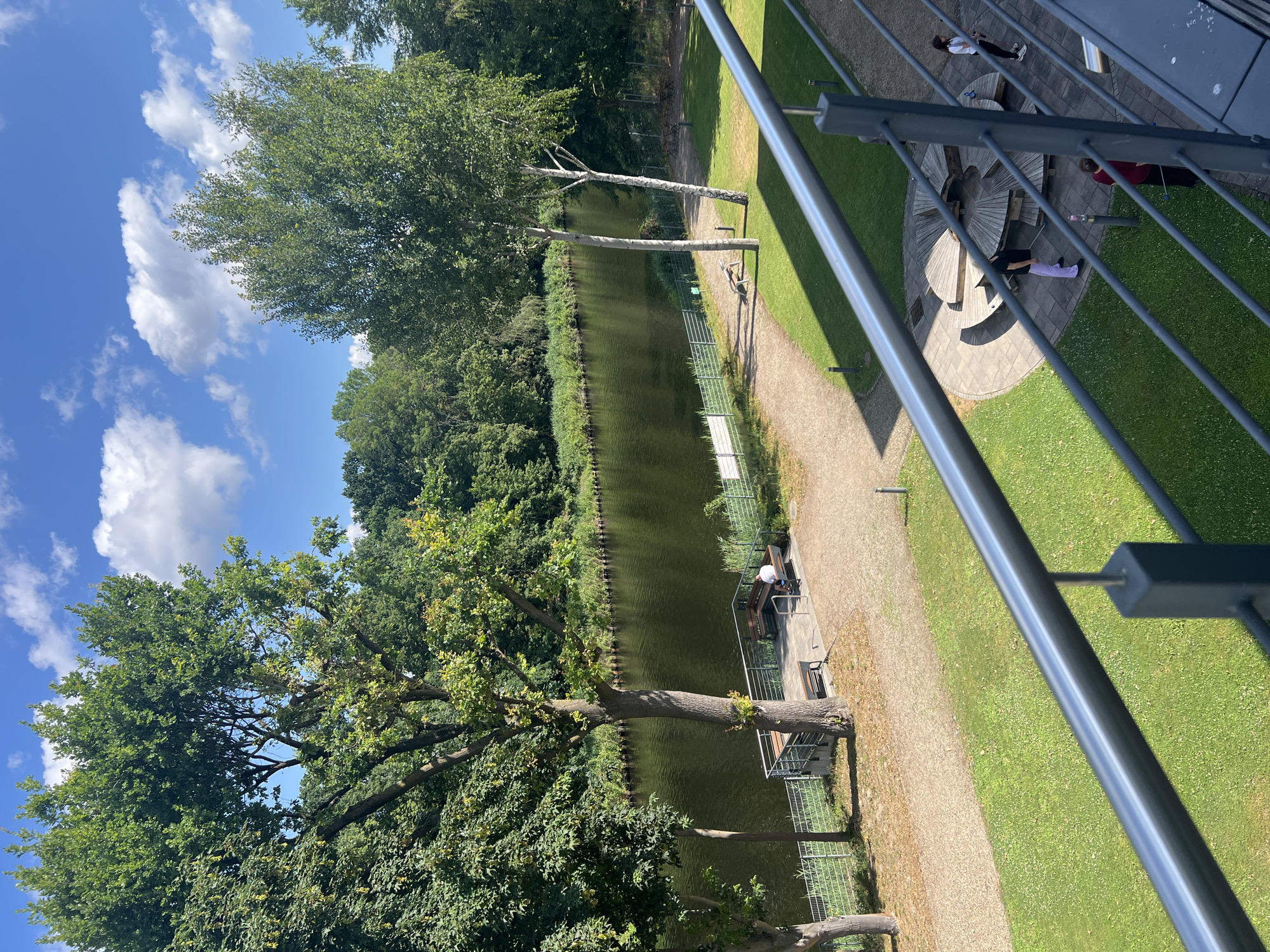 Police and leisure boats share a Teltow canal on a summer morning