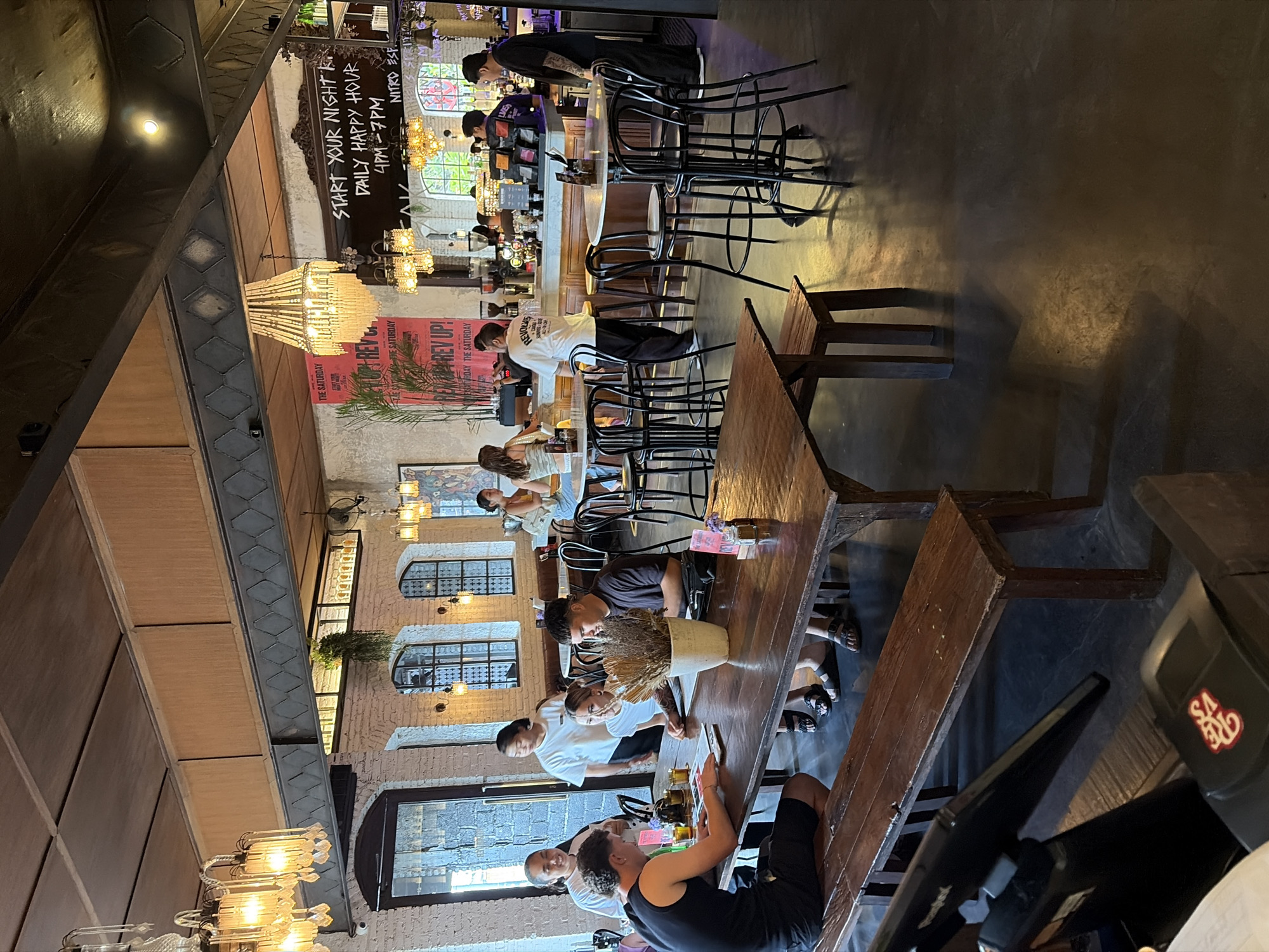 Inside a rustic Bali cafe, with street scenes just outside