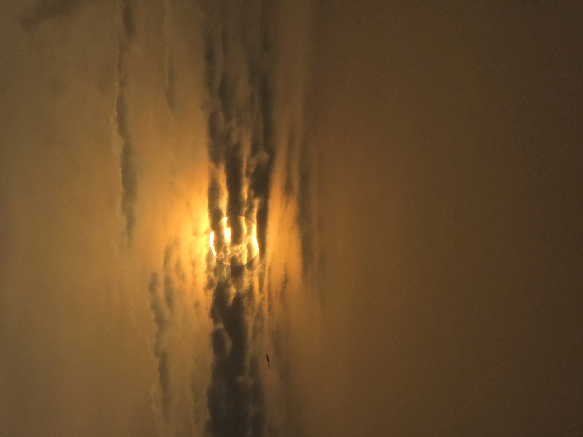 Orange-tinted cloudy sky observed in Mumbai