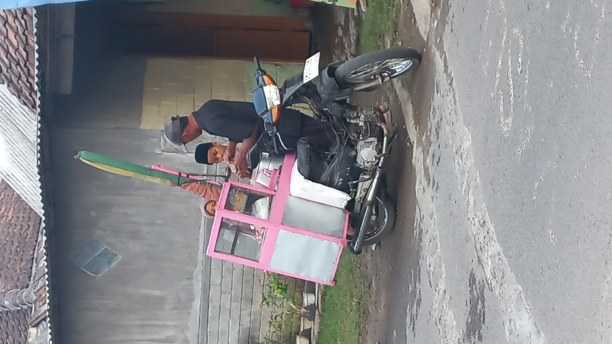 Quiet morning street life in Pare, East Java