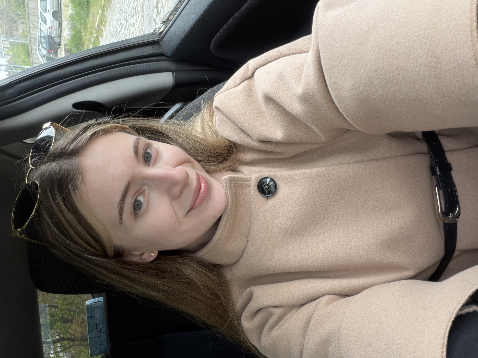 Woman takes selfies in car in Plovdiv, Bulgaria