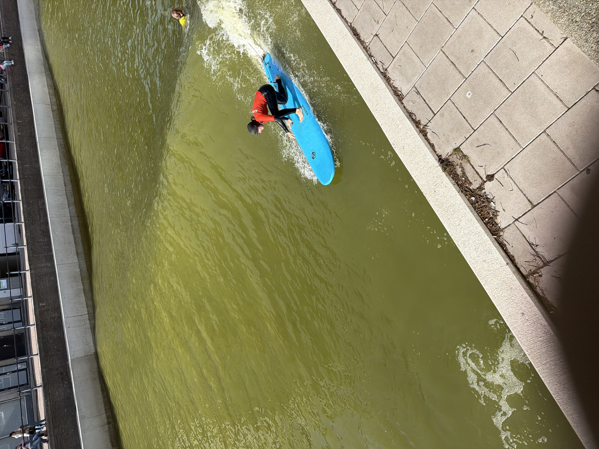 Urban canal surfing in Rotterdam on a weekday afternoon