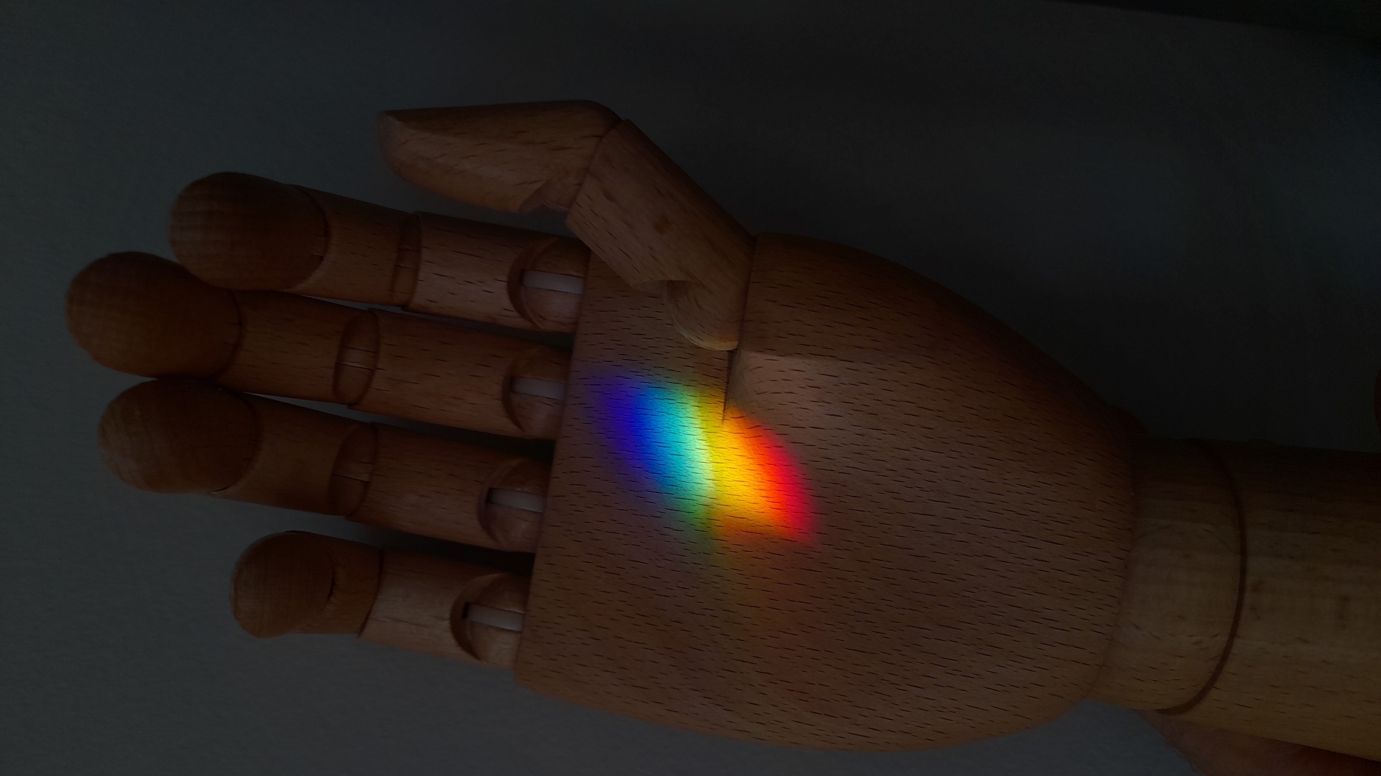 Rainbow light projections documented across surfaces in Saint Petersburg