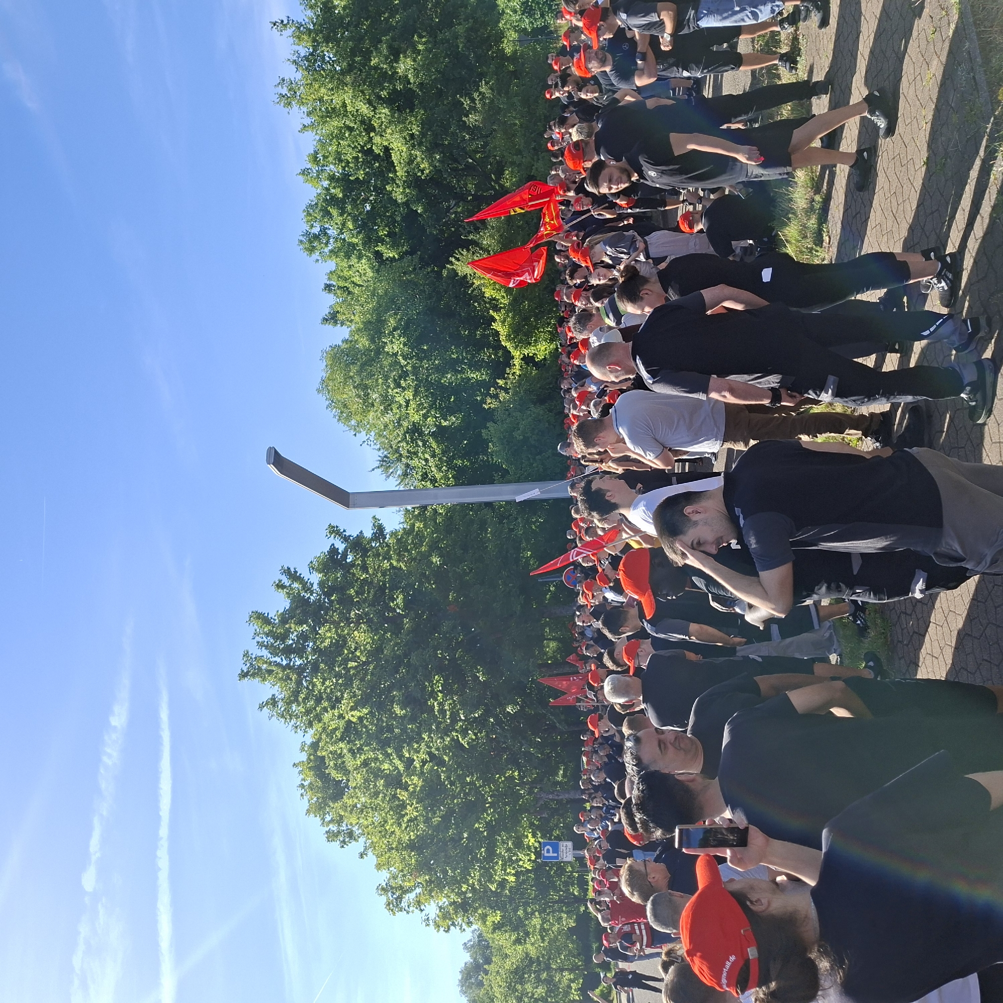 Red-clad crowd rallies outdoors in Rastatt, Germany