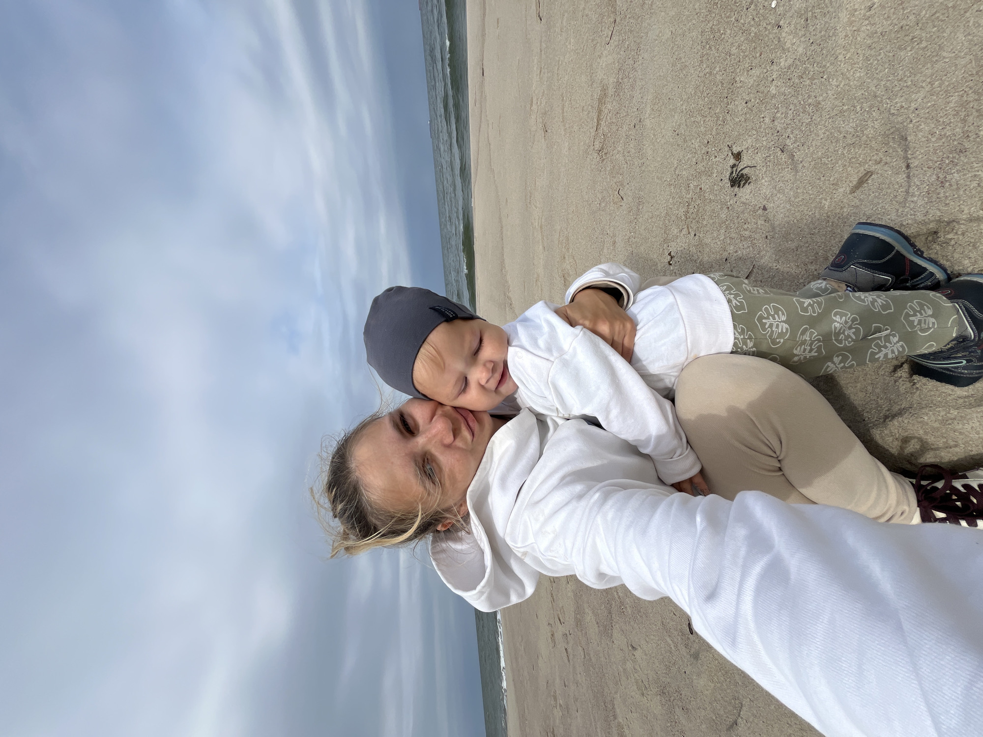 Laid-back beach day with a baby, selfies, and distant ships