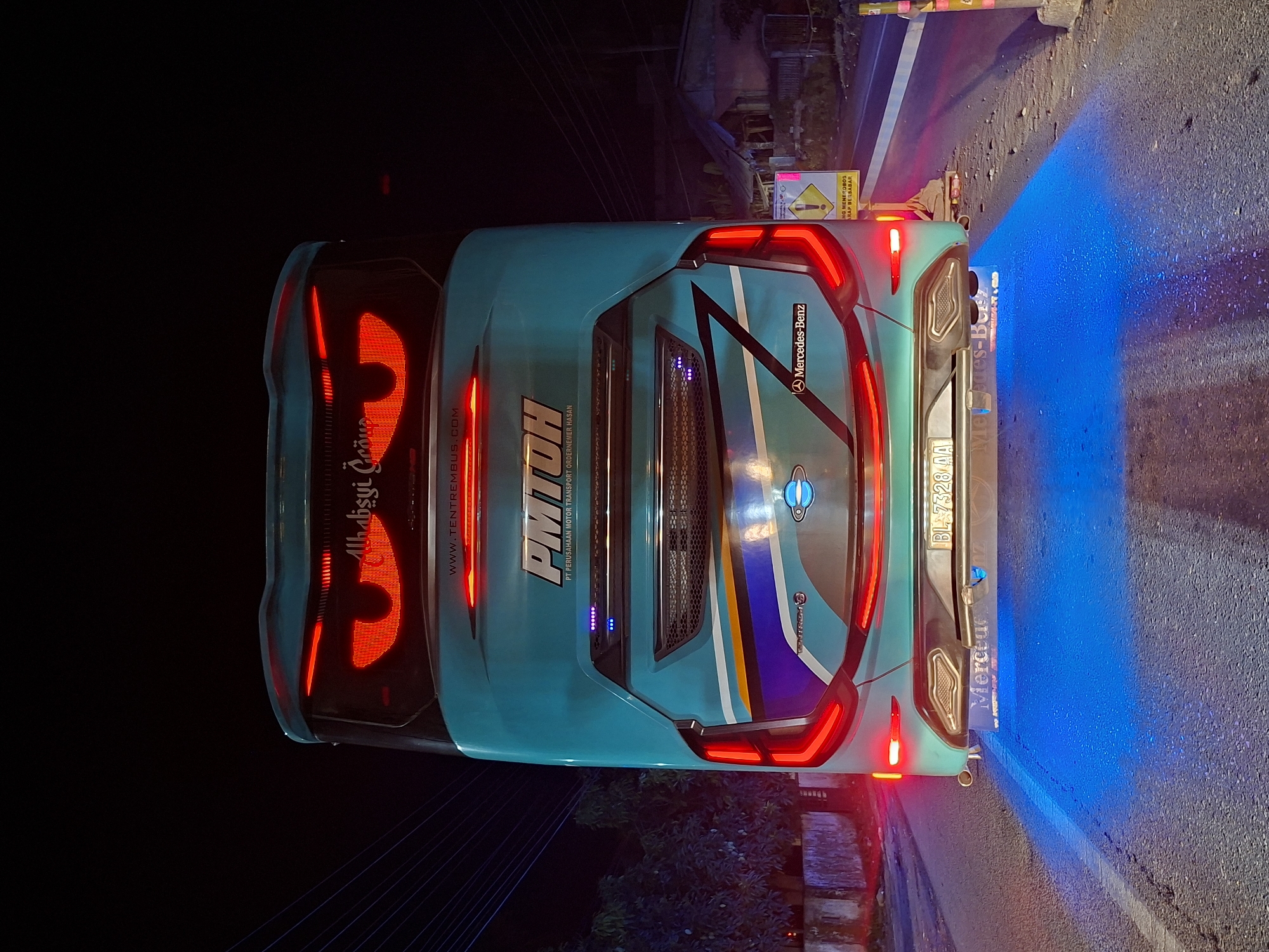 PMTOH bus observed at night in Lhokseumawe, Indonesia