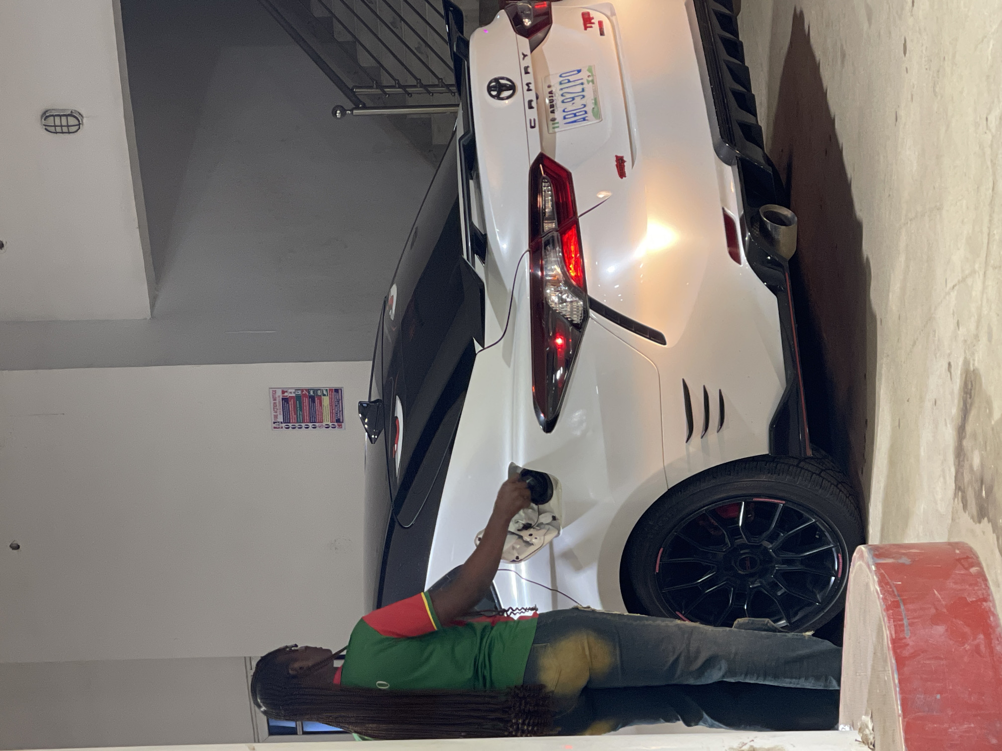 Late-night fuel stop in Guzape with a custom Camry