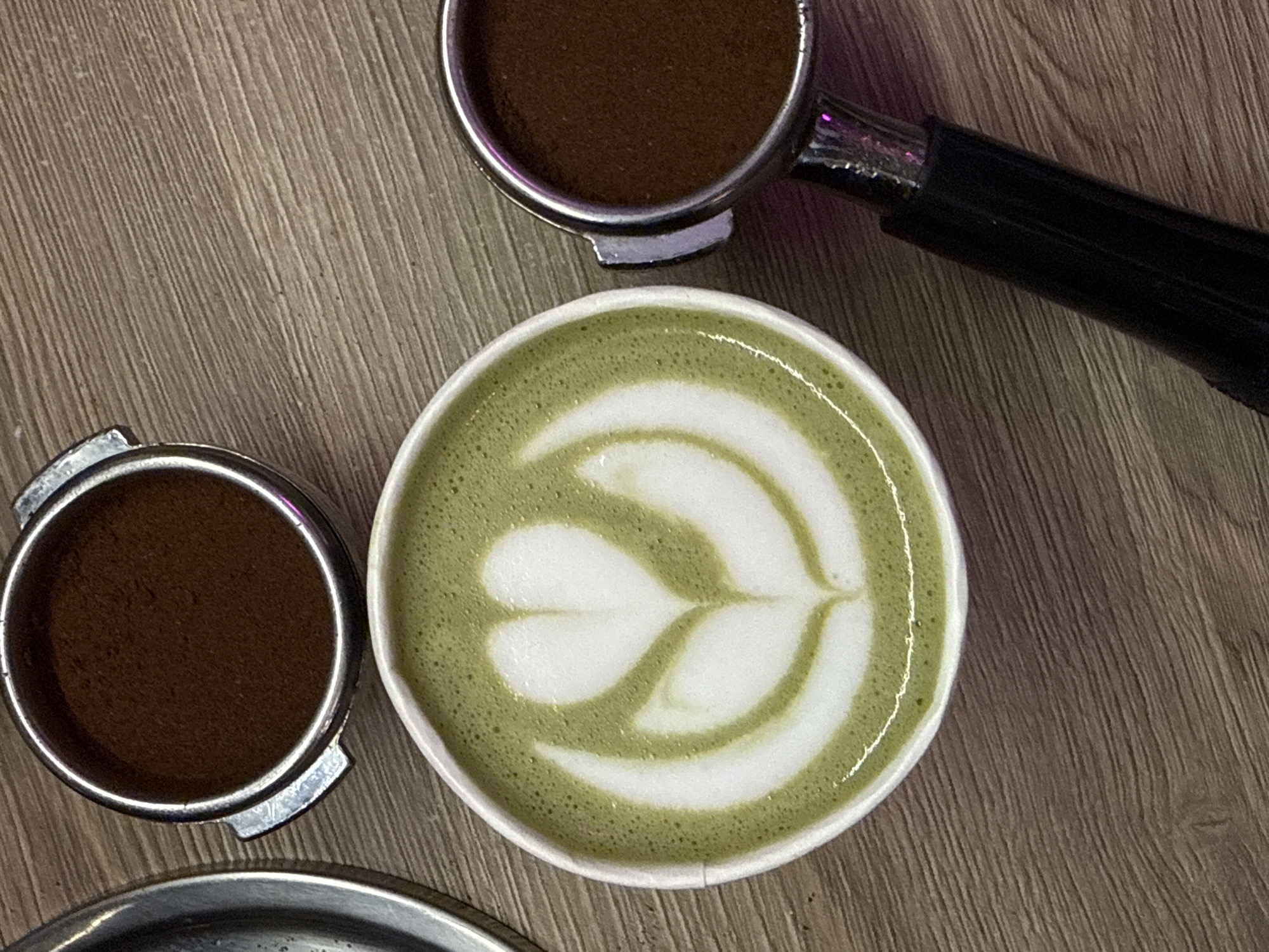 Green matcha latte prepared at Moscow coffee station