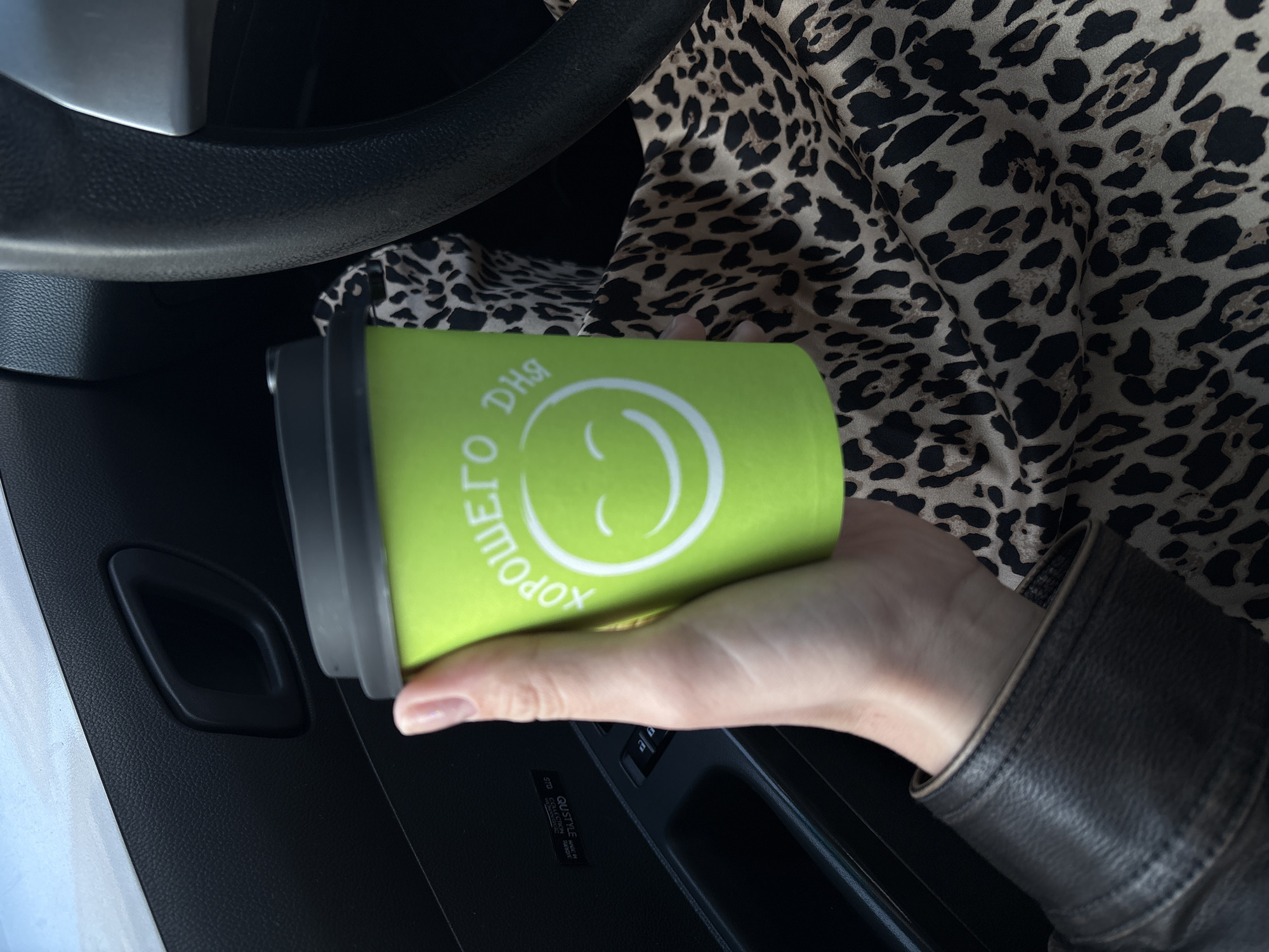 Driver enjoys morning coffee during commute in Ust-Ilimsk