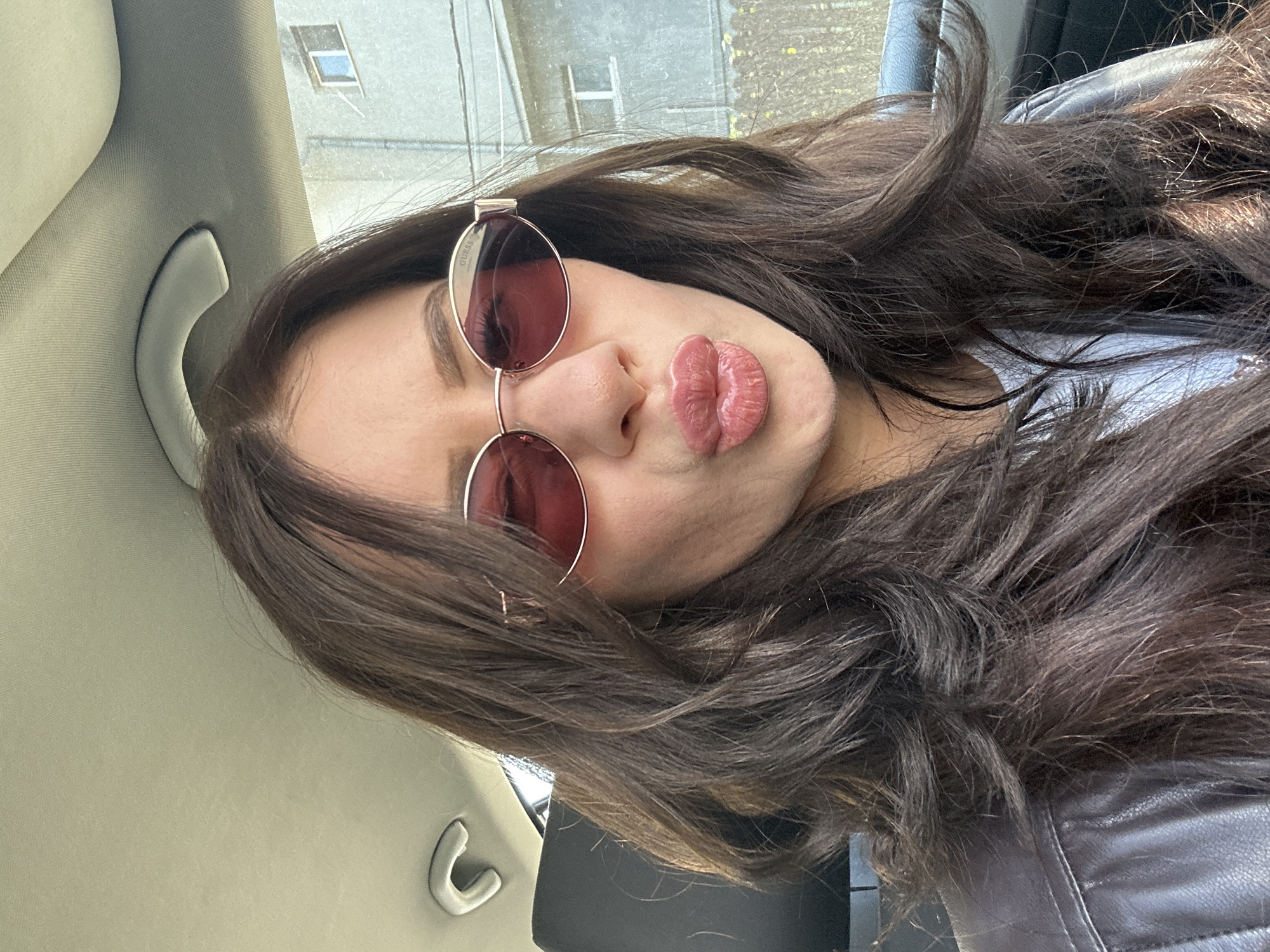 Woman takes morning selfies in vehicle in Plovdiv
