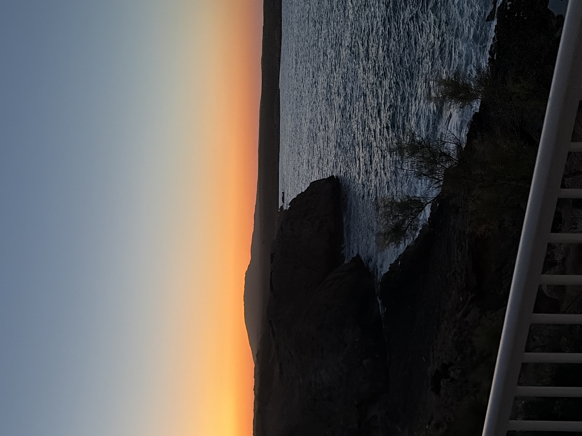 Rocky coastline meets a fading sunset in Menorca