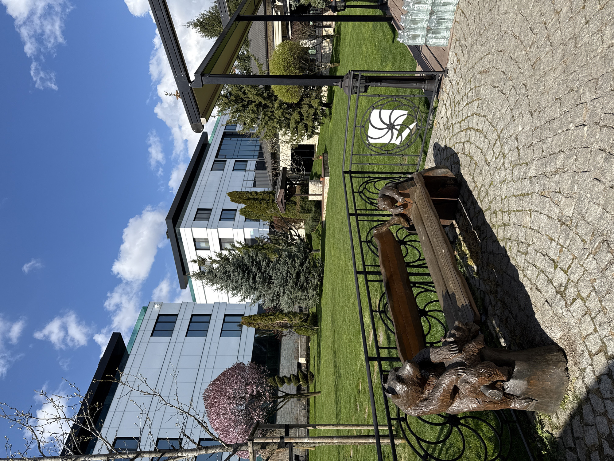 Modern building and manicured garden observed in Sofia