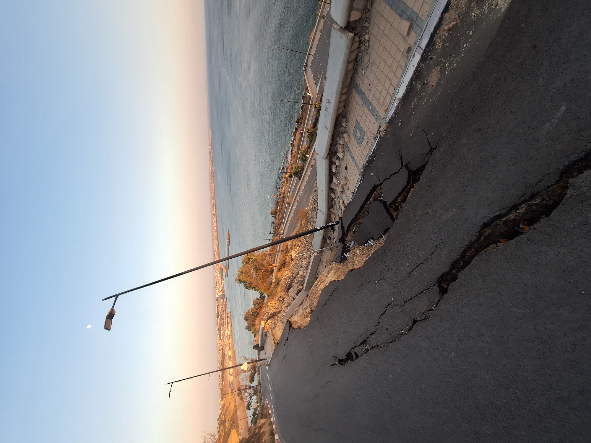 Coastal road damage documented at dusk in Safi, Morocco