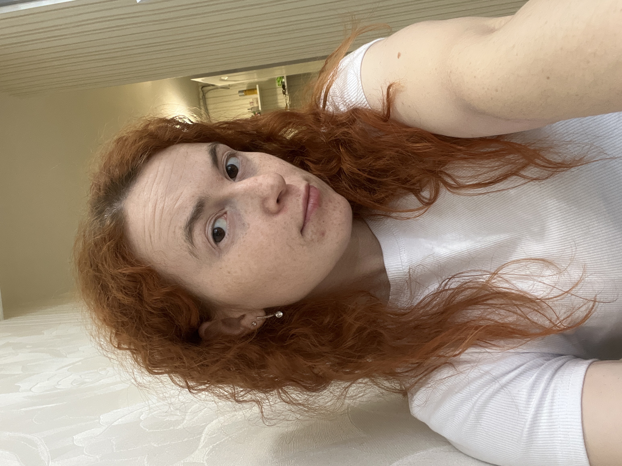 Woman takes selfies indoors in Chaikovsky, Russia