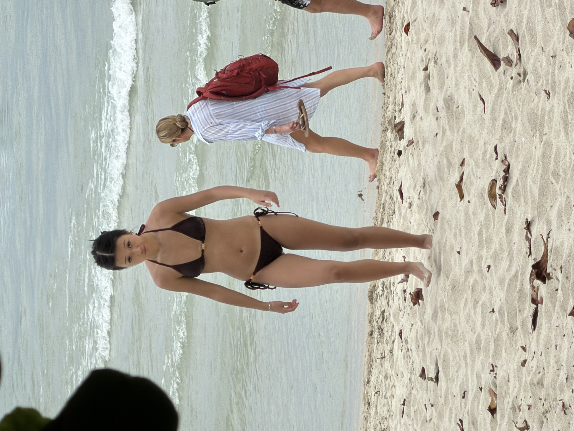Beach morning in Ko Samui with vendors, swimmers, and wildlife