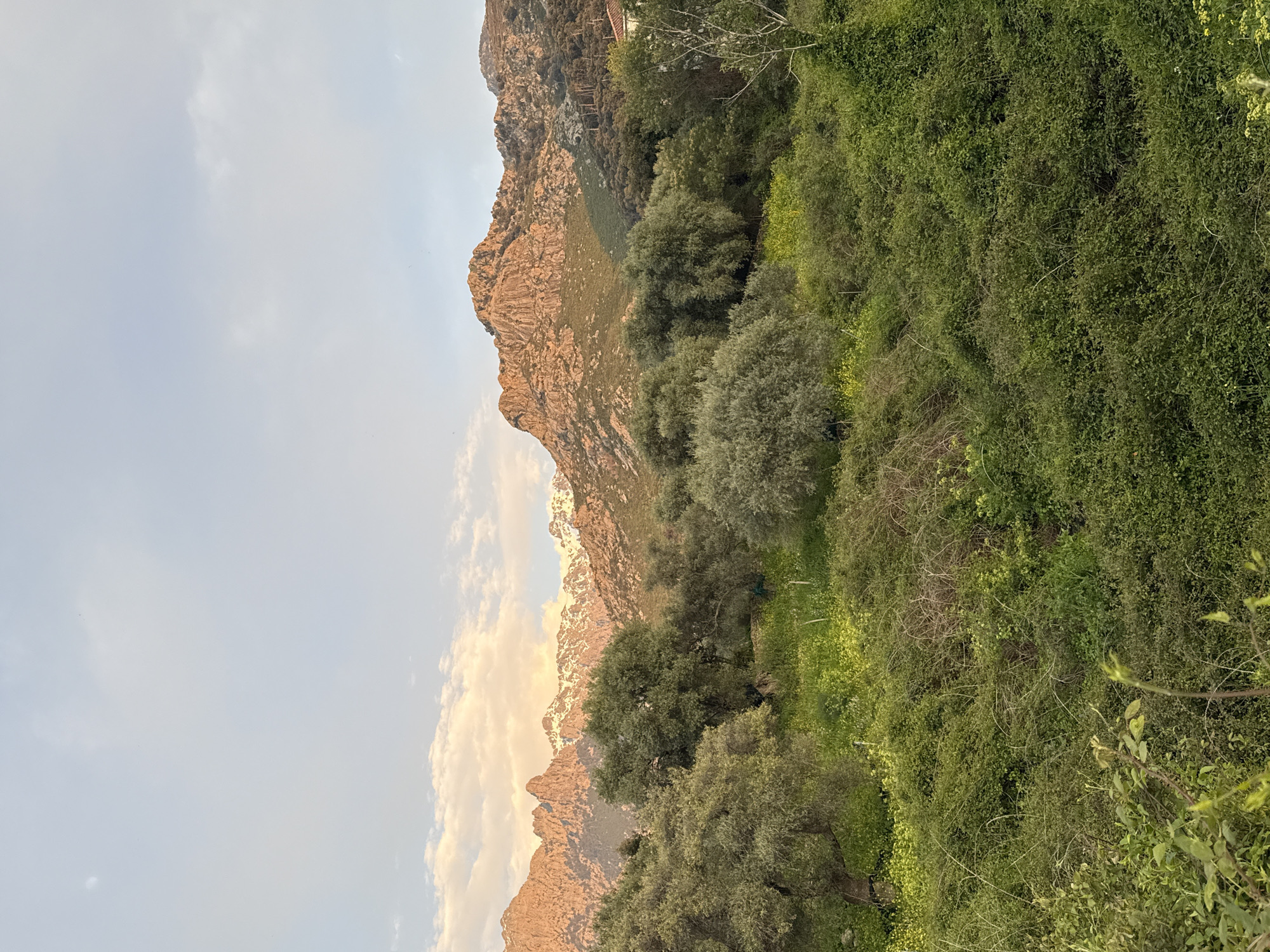Sunset illuminates snowy peaks in Calenzana mountain landscape