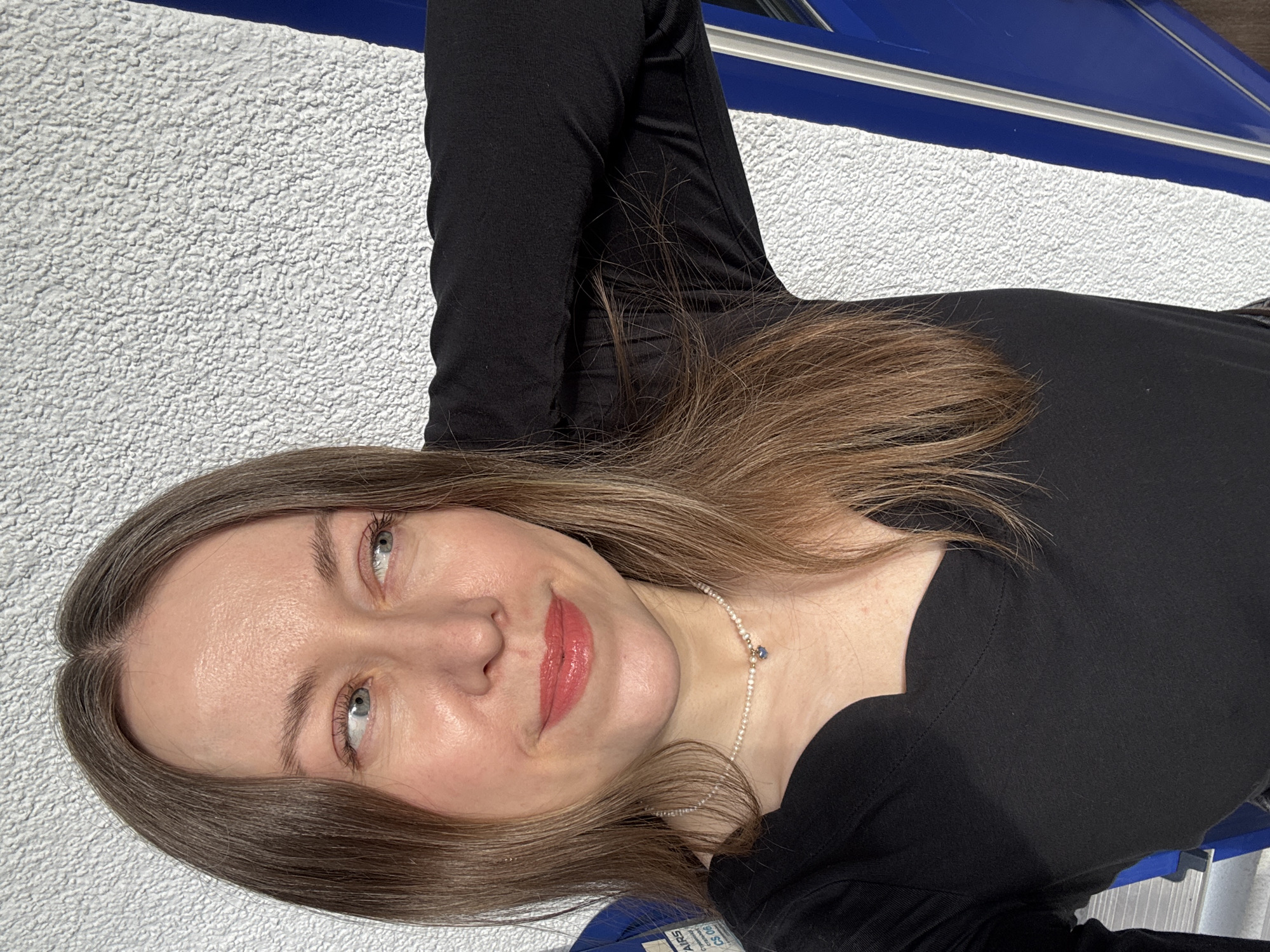 Woman photographs herself in multiple poses in Kudrovo