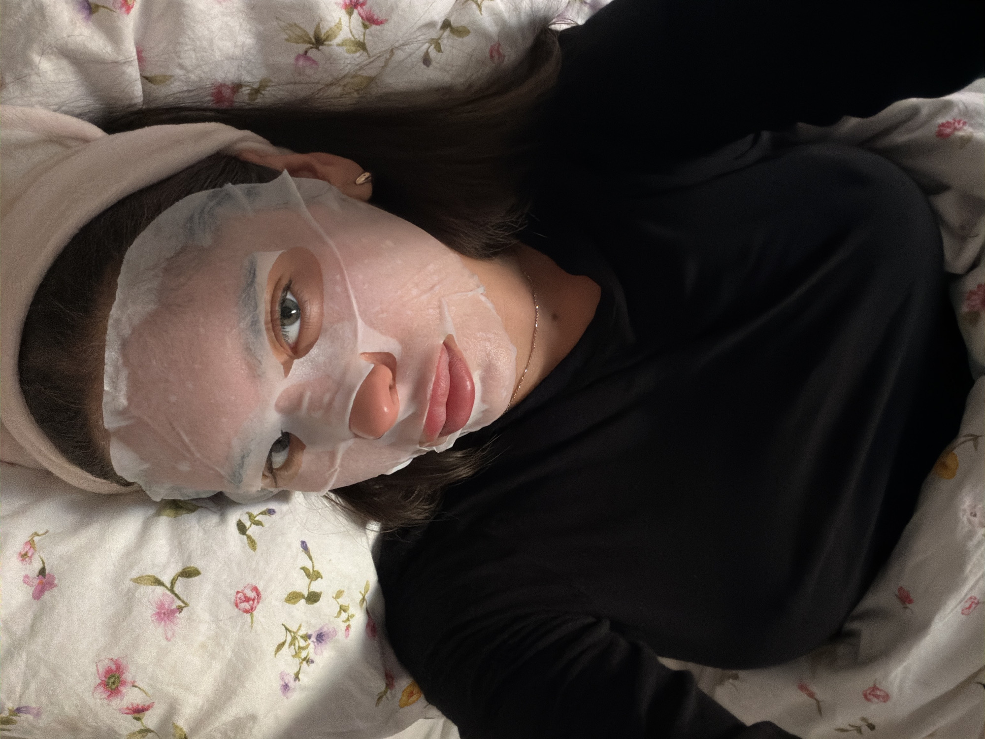 Woman performs skincare routine at home in Krasnoyarsk