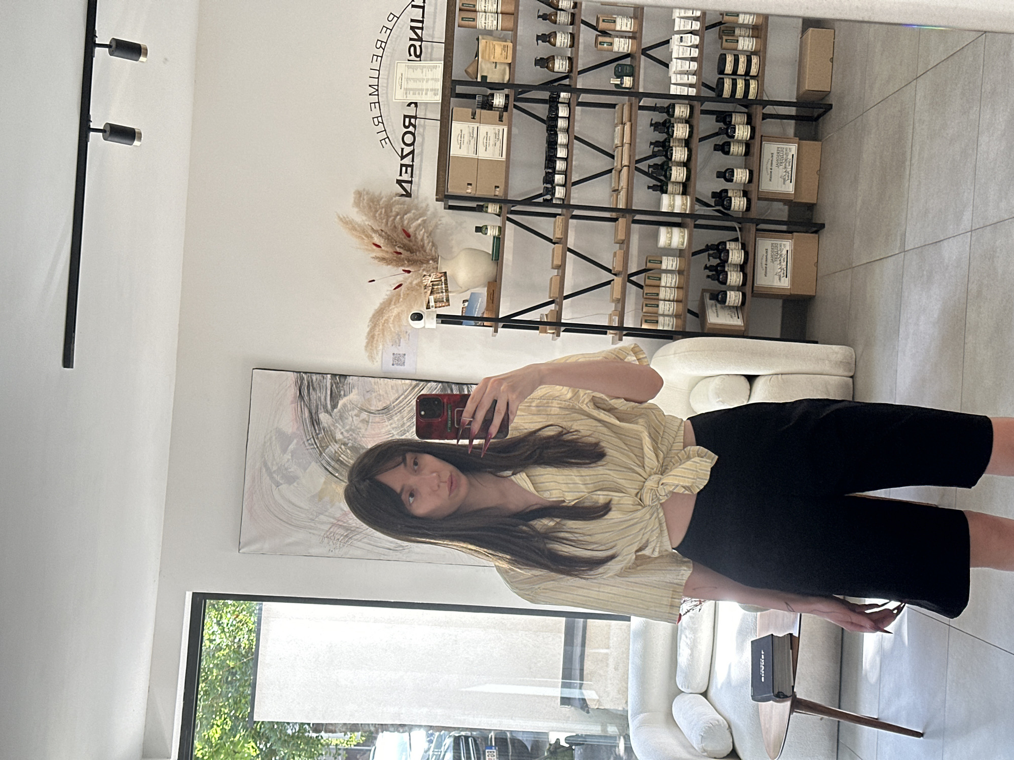 Woman takes selfies at salon in Belgrade's Vracar district
