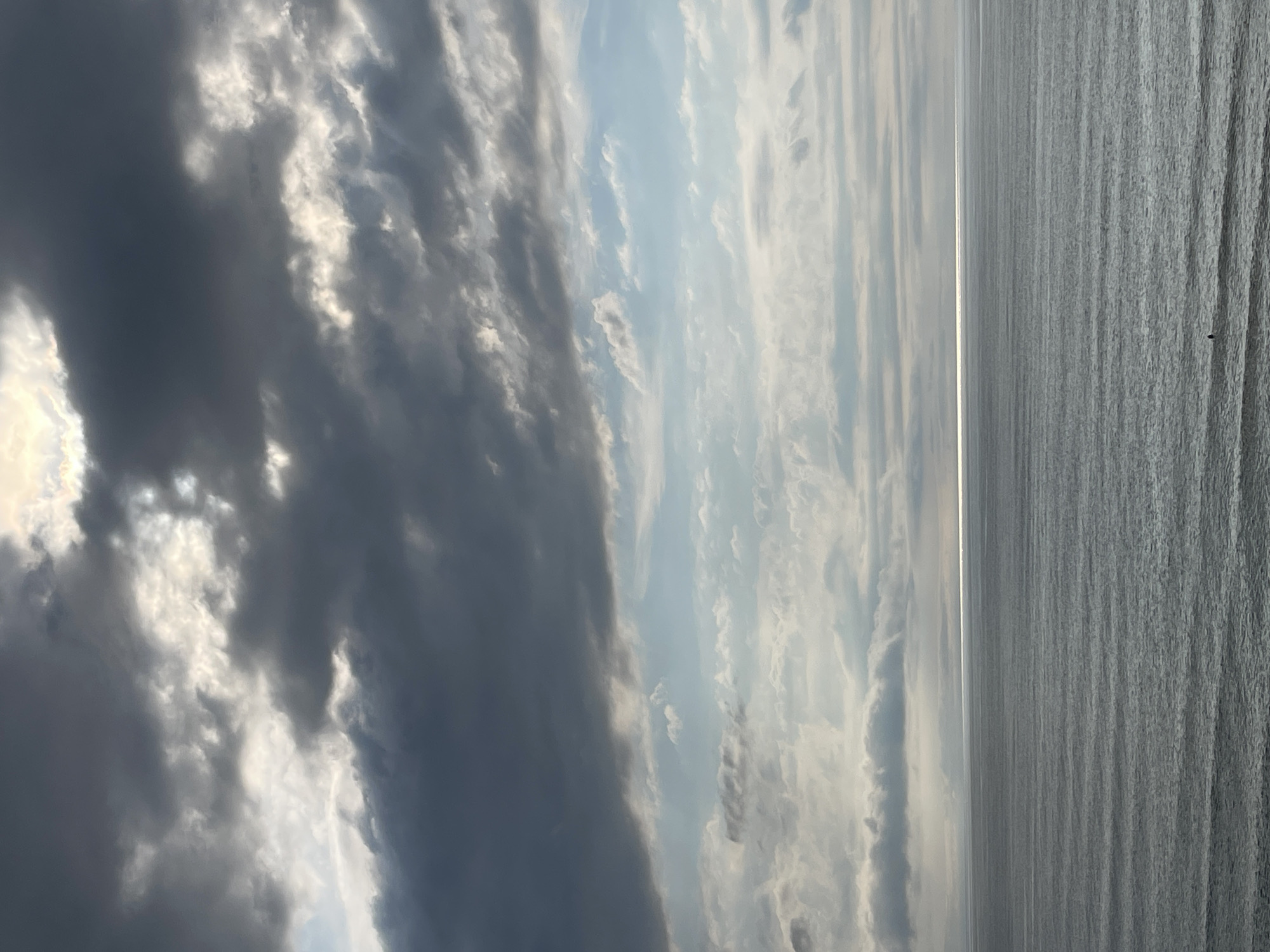 Dawn seascape observed with varied cloud formations