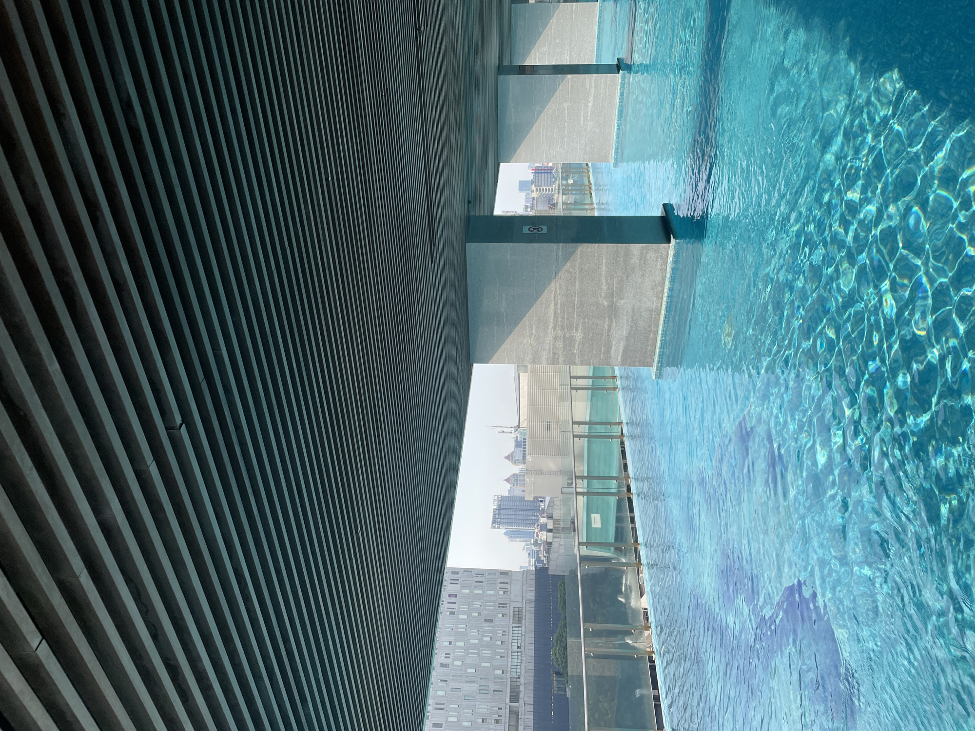 Morning pool activities documented at Jakarta rooftop facility