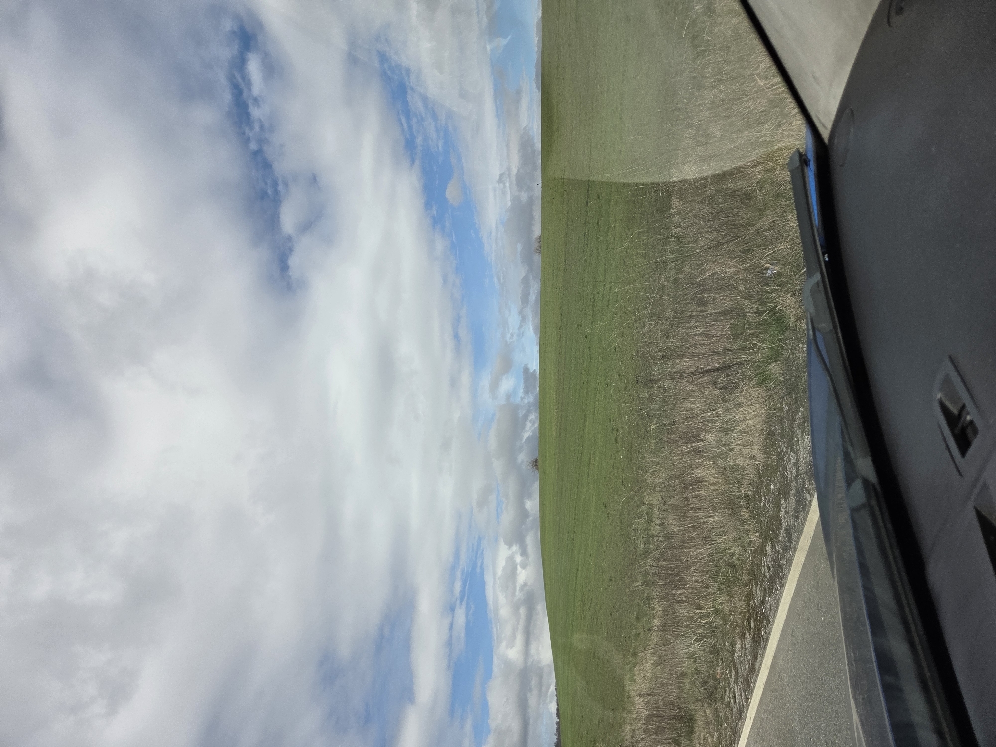 Vehicle passenger captures countryside view near Panicharevo, Bulgaria