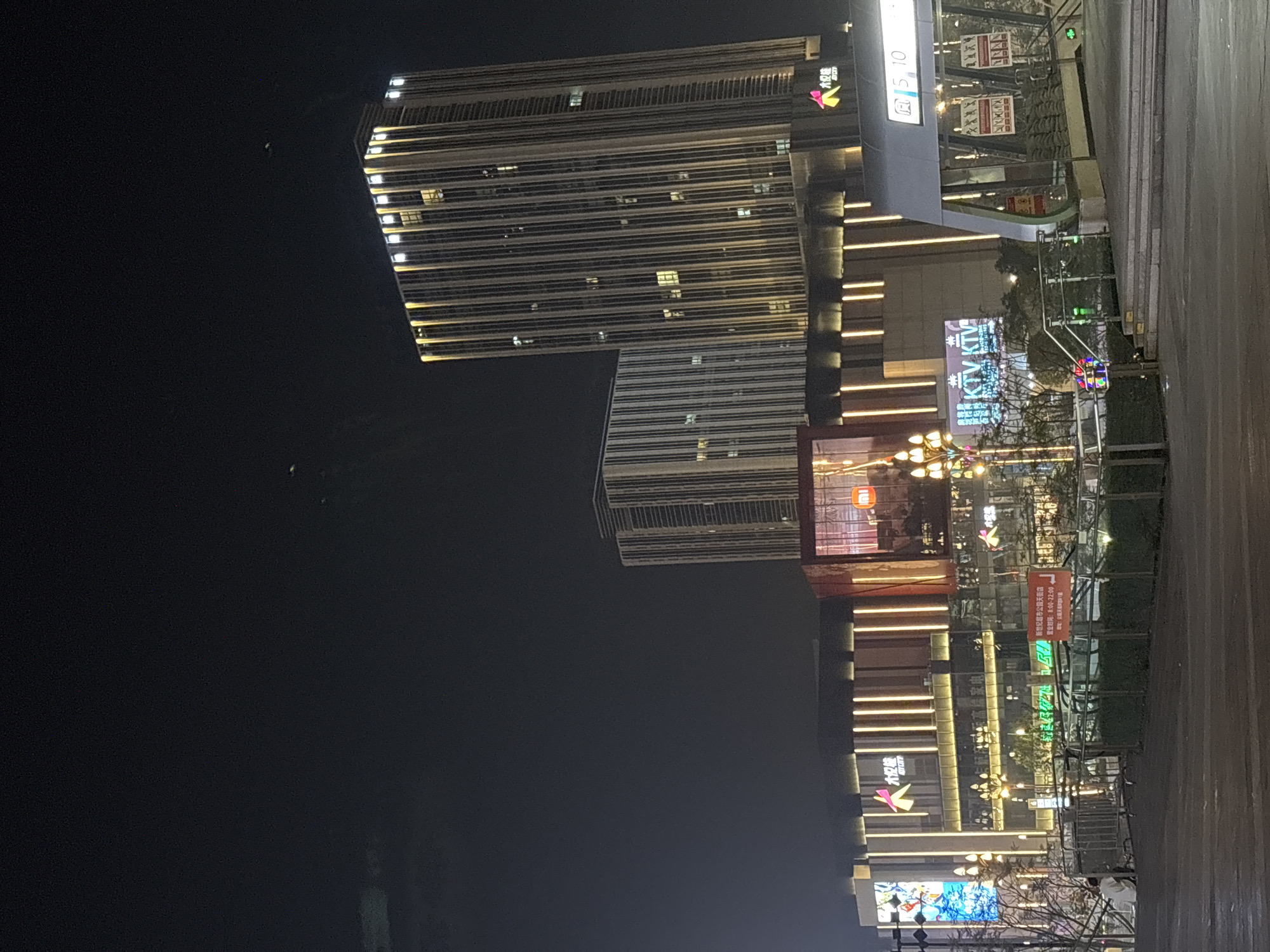 Nighttime urban photography session captures modern Liangjiang city streets