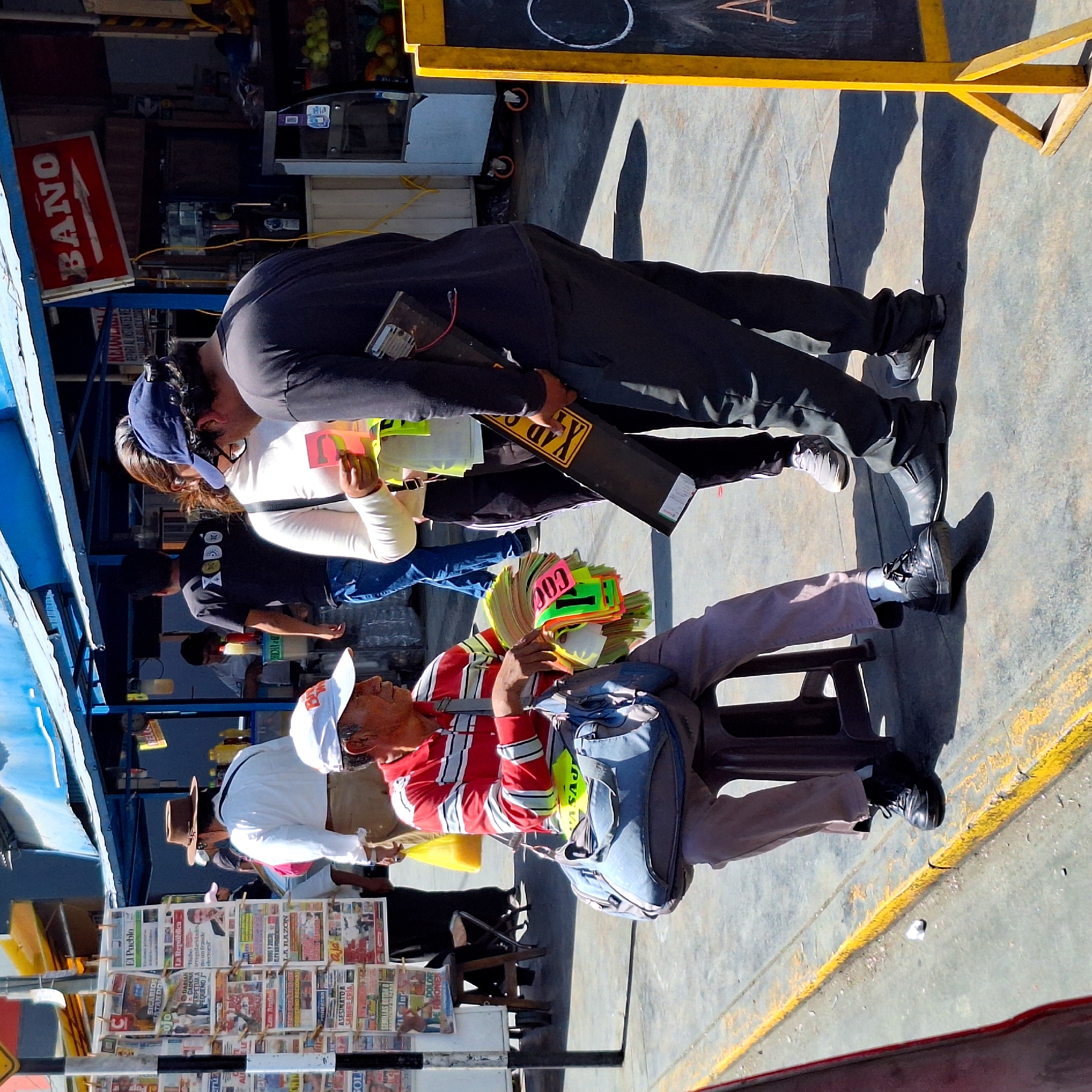 Man sells license plate signs on Arequipa street