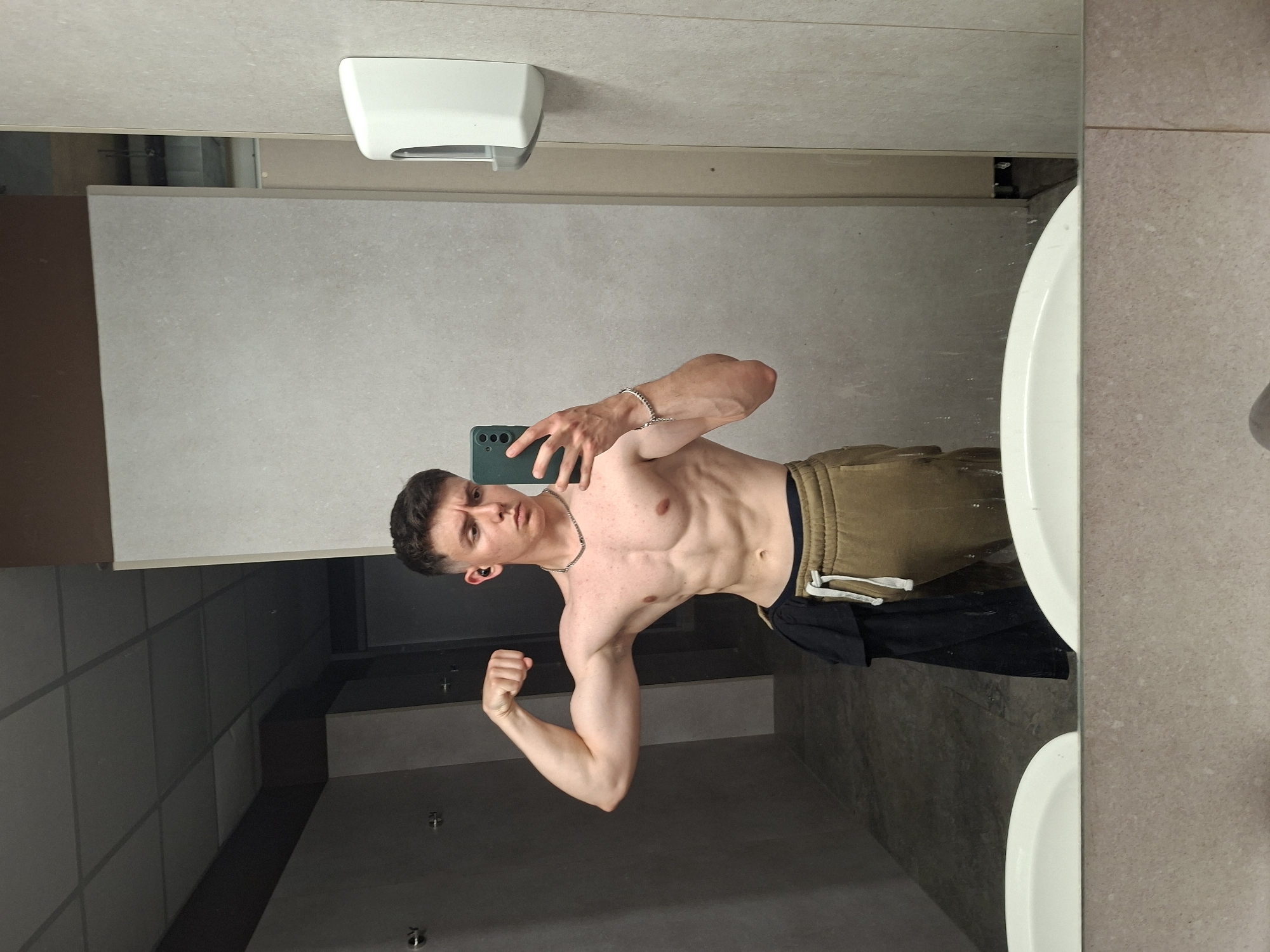 Young man takes shirtless bathroom selfies in Plovdiv