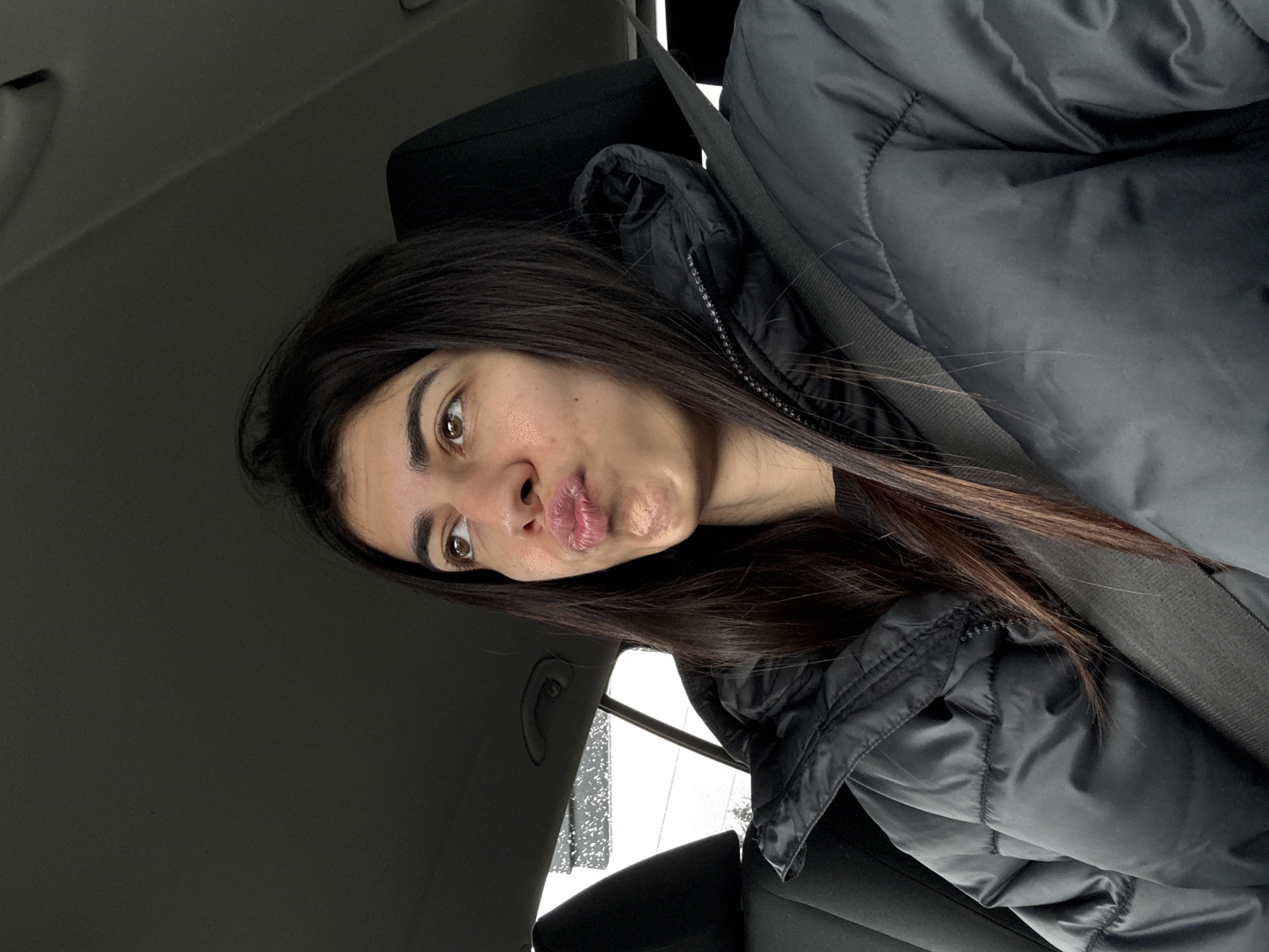 Woman takes selfie in car in Sofia