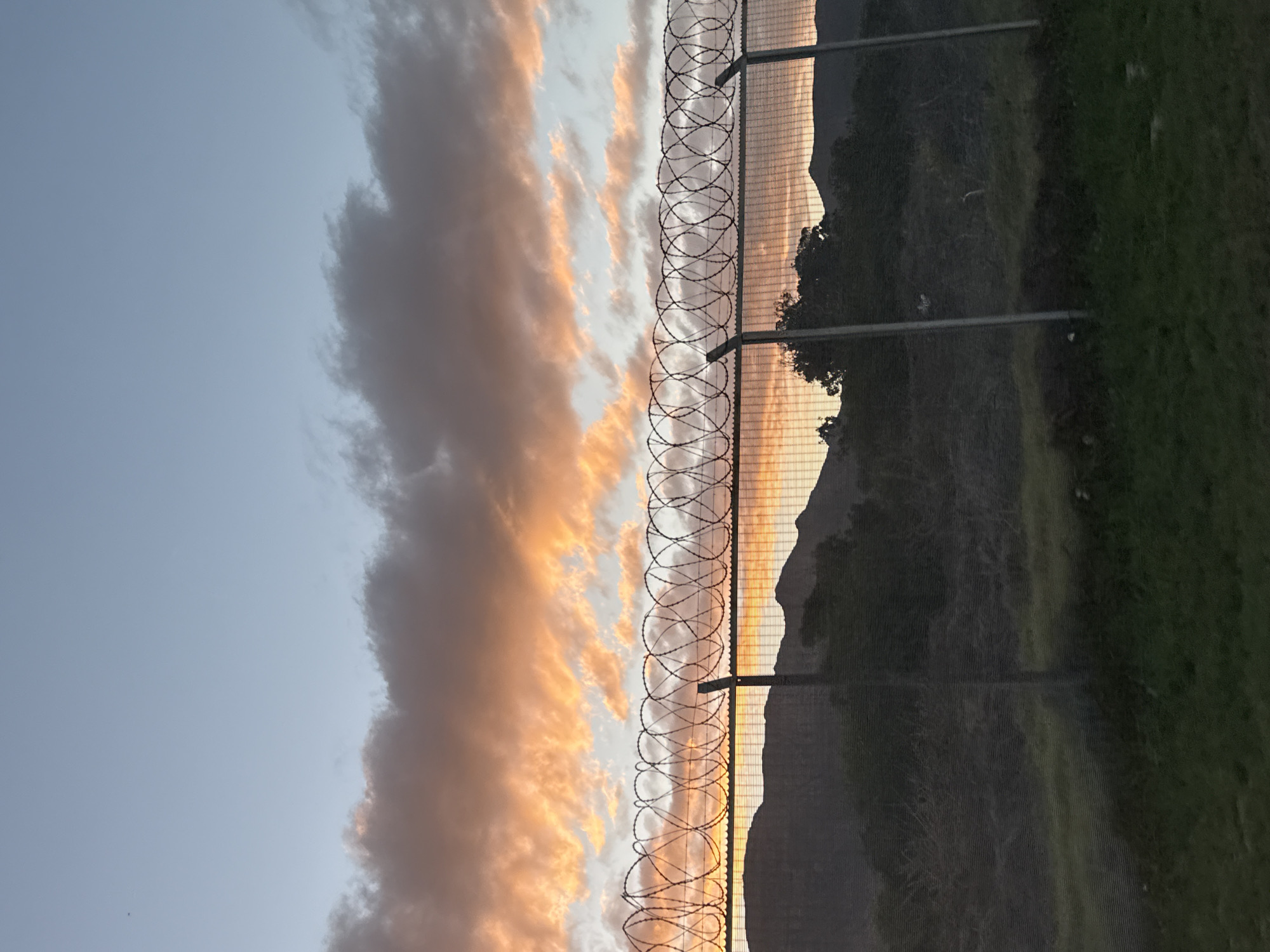 Fenced sunset captured over Cape Town mountains