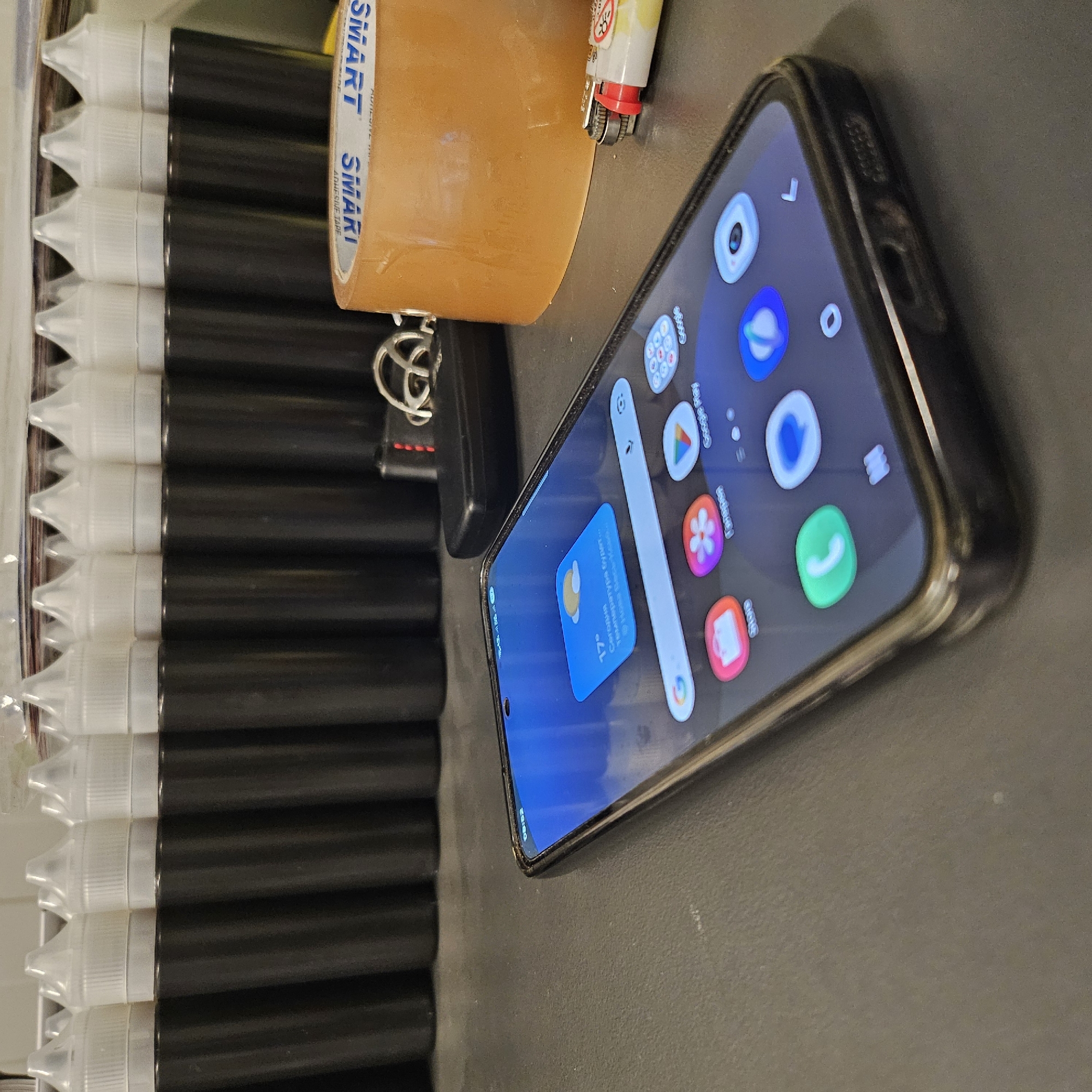 Ray-Ban glasses and e-liquid bottles on a table in Poland