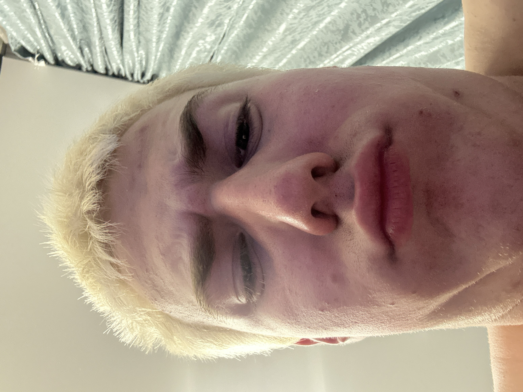 Portrait series of blonde man documented across evening hours