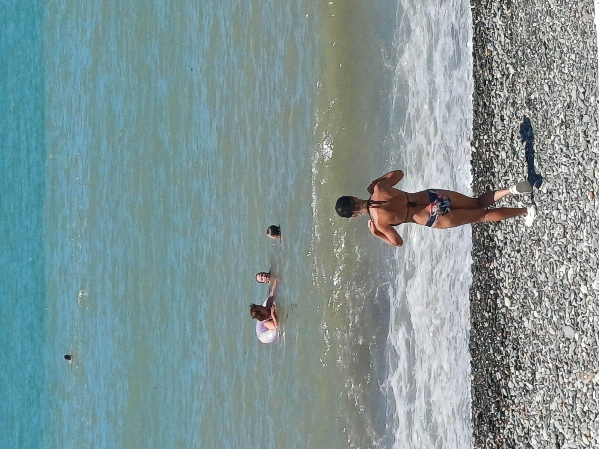 Sochi's Black Sea beach buzzing on a sunny summer morning