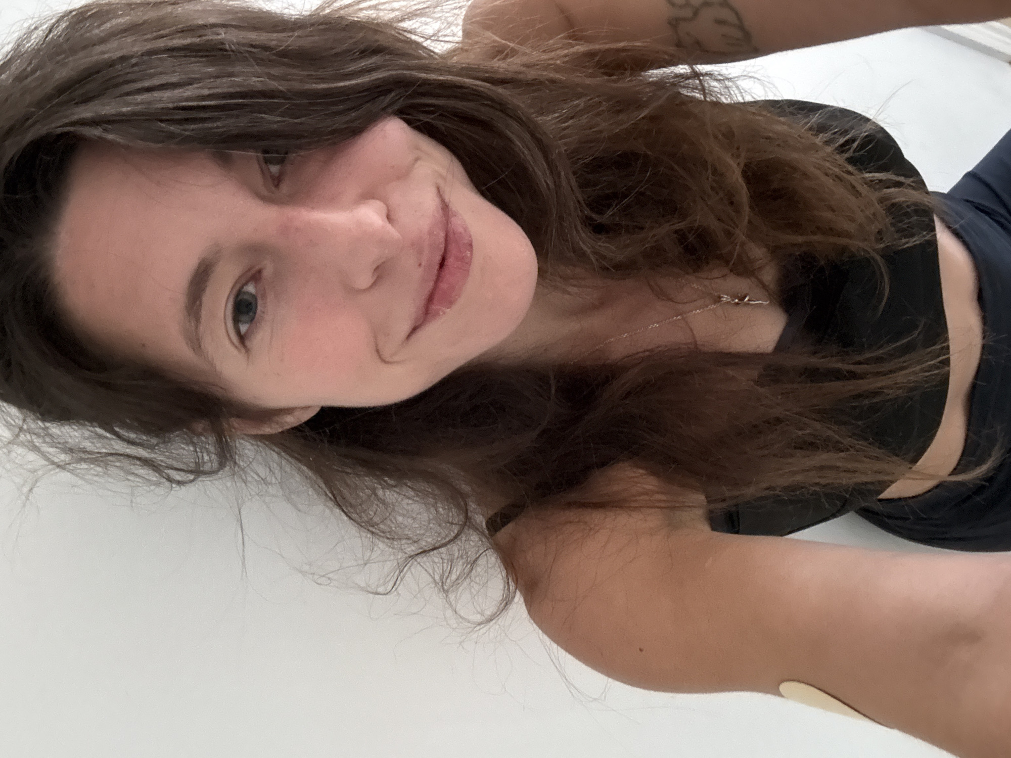 Woman takes selfie in Barcelona wearing sports attire