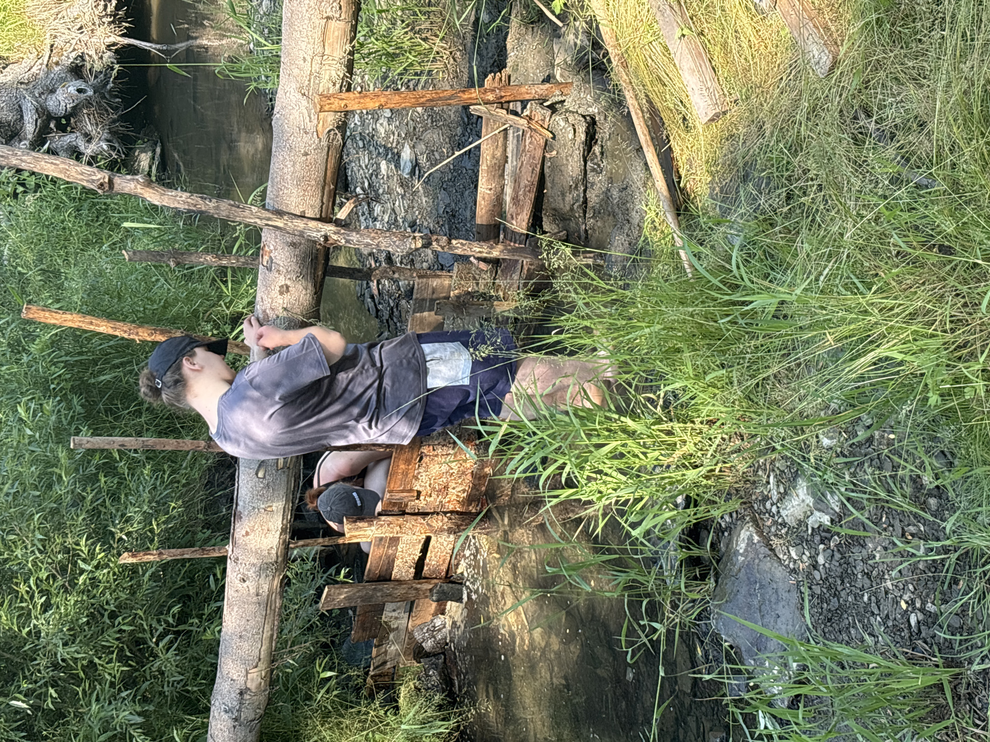 Hands-on work beside a log-bridged stream in rural Czechia