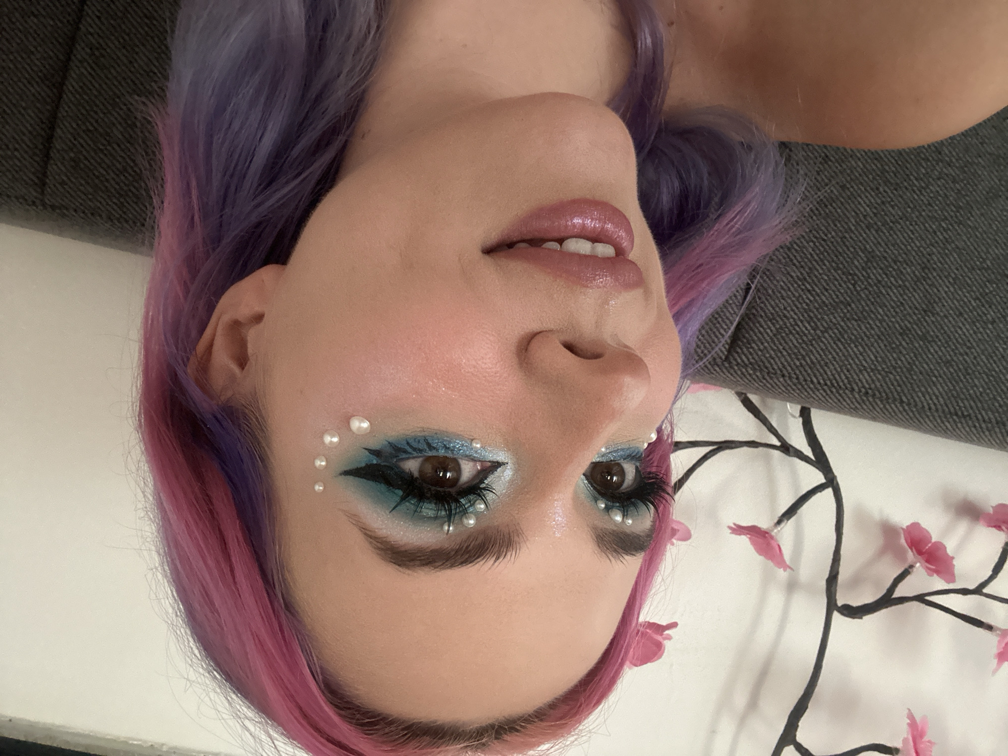 Colorful-haired person photographed with distinctive makeup in Zagreb